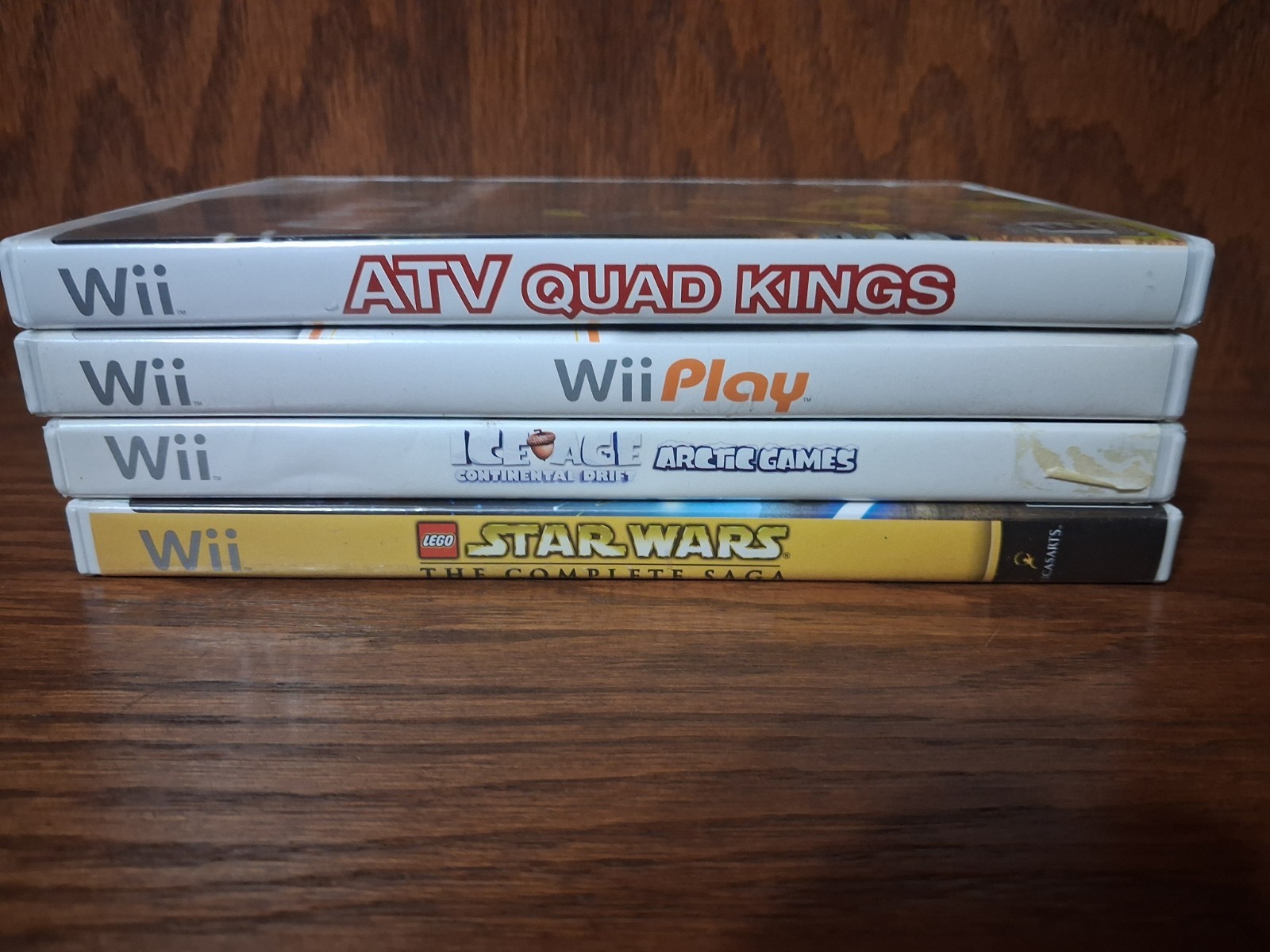 Nintendo Wii Game Lot: Ice Age, Wii Play, LEGO Star Wars, ATV Quad Kings & more.