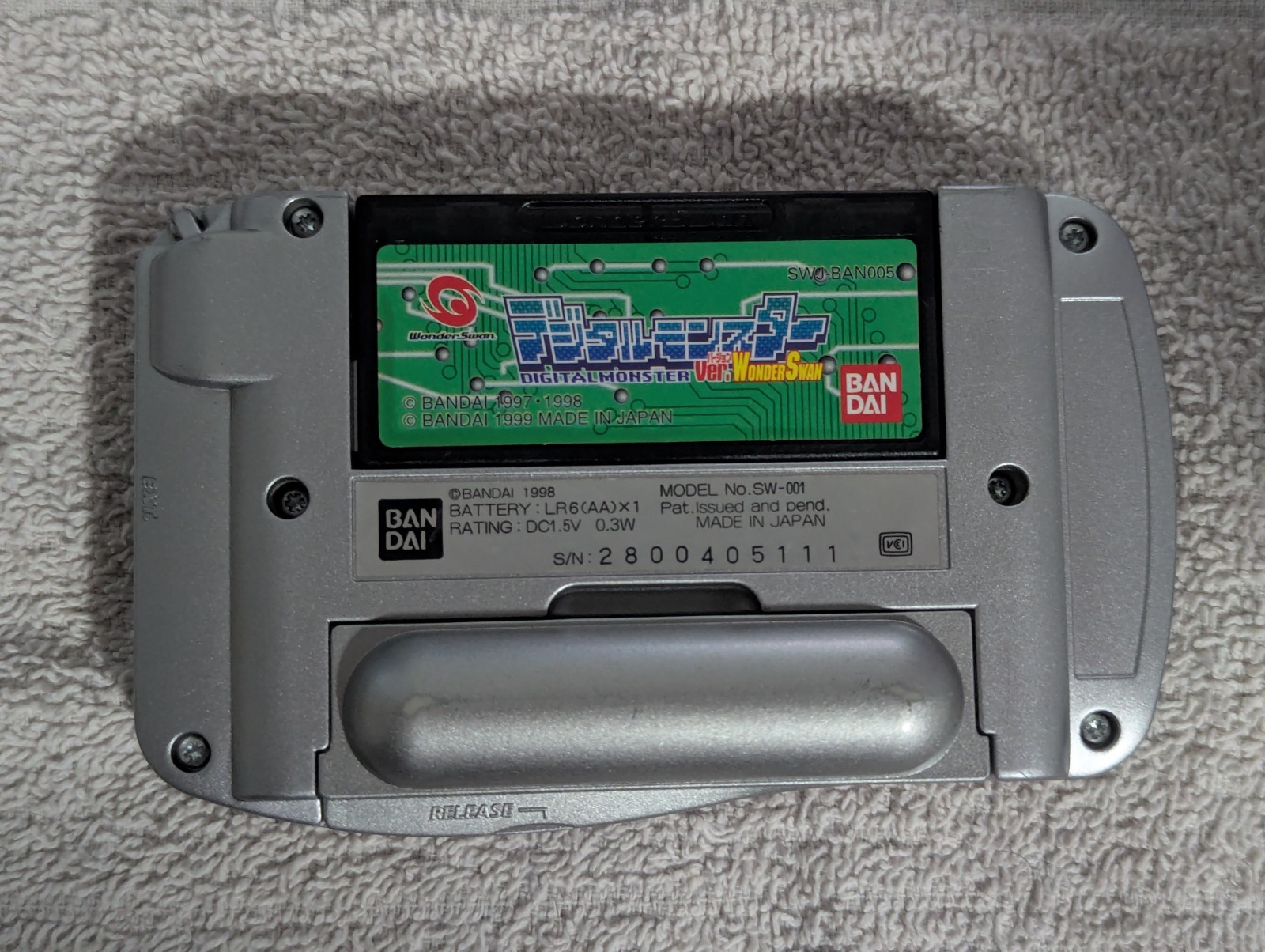 Bandai WonderSwan, Silver. With Digimon