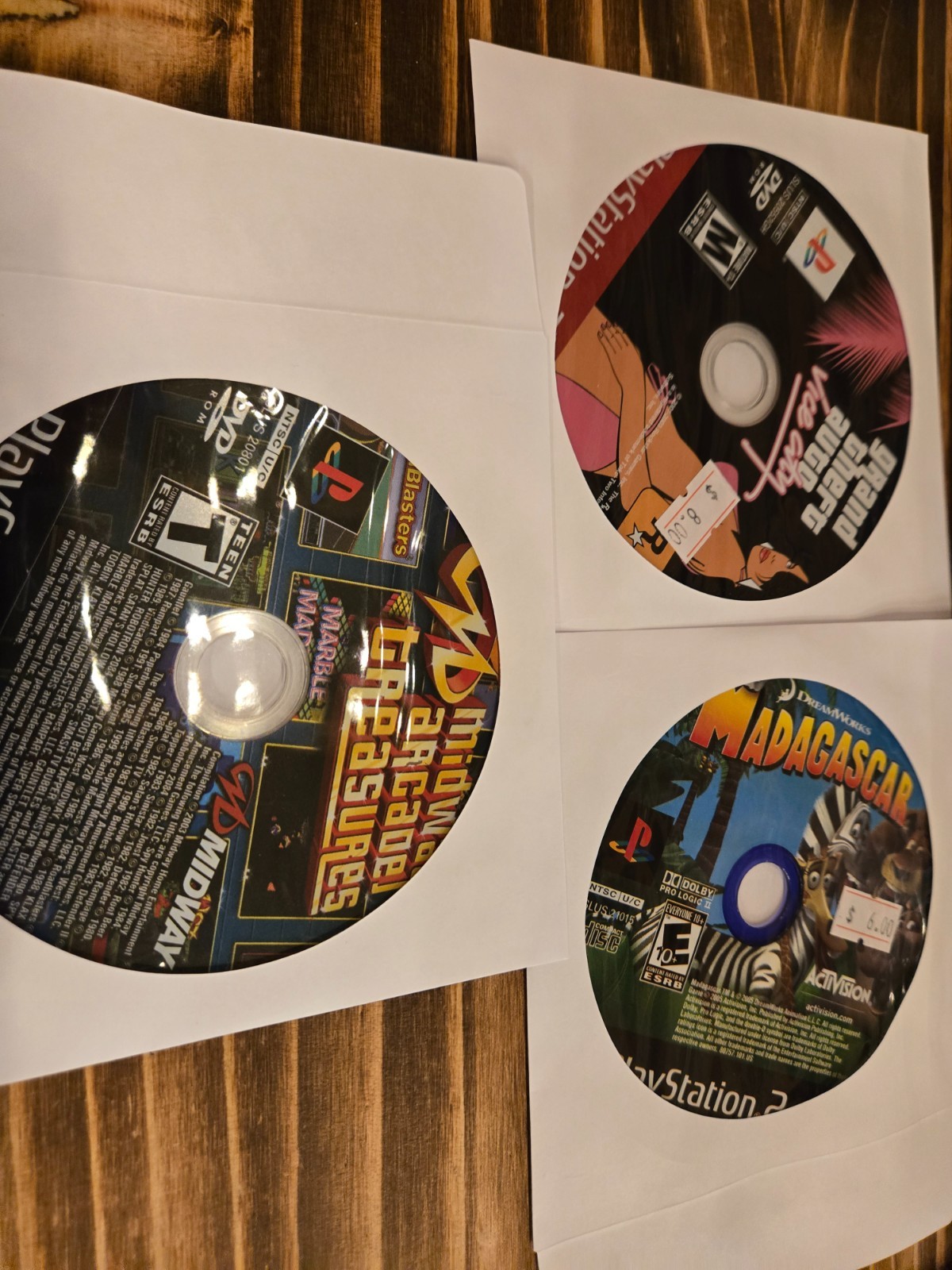 3 game ps2 bundle- Madagaskar, Midway arcade treasures, GTA vice city (GF)