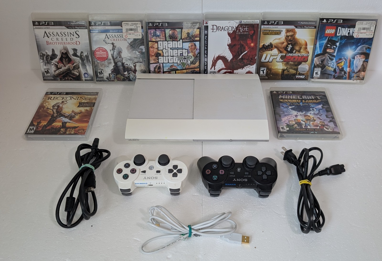 Sony PS3 Super Slim 500GB White Console Bundle 2 OEM Sony Controllers 8 Games…