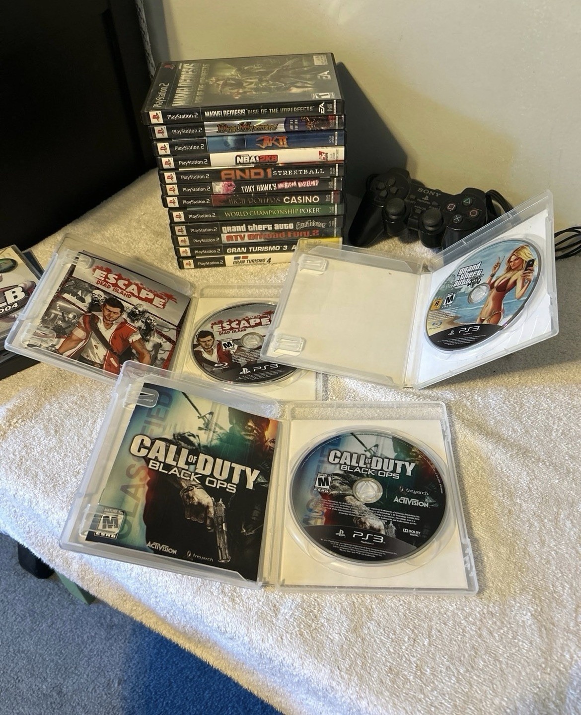PlayStation 1, 2, & 3 Game lot. 19 total games & PS2 wired controller. Used