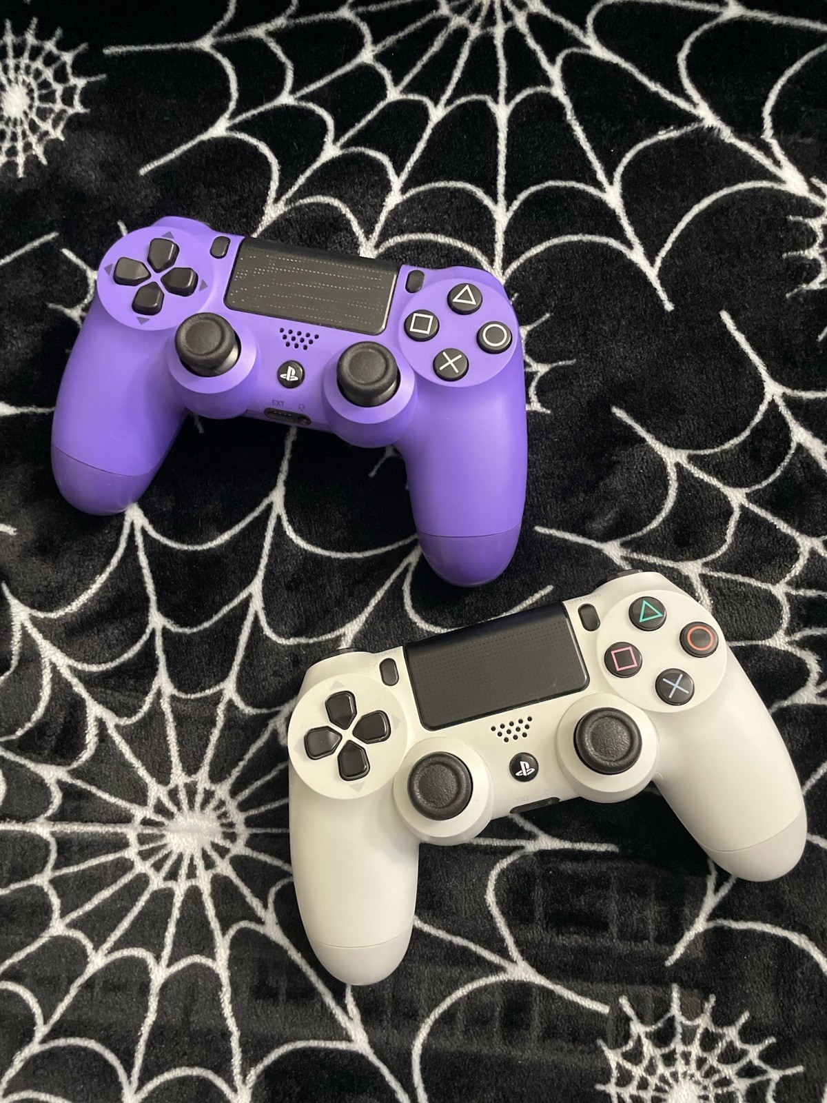 Sony PlayStation Black PS4 and White and Purple Wireless Controllers Bundle