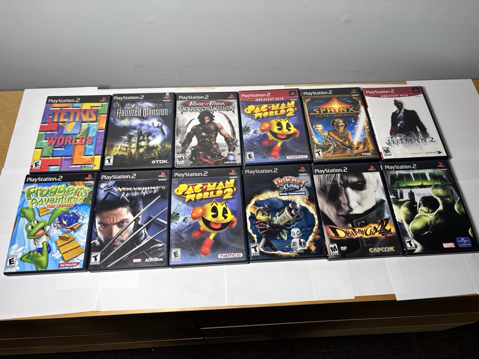 12 PlayStation 2 PS2 Games CIB Tested Lot Ratchet Sphinx Pac-Man Haunted Mansion
