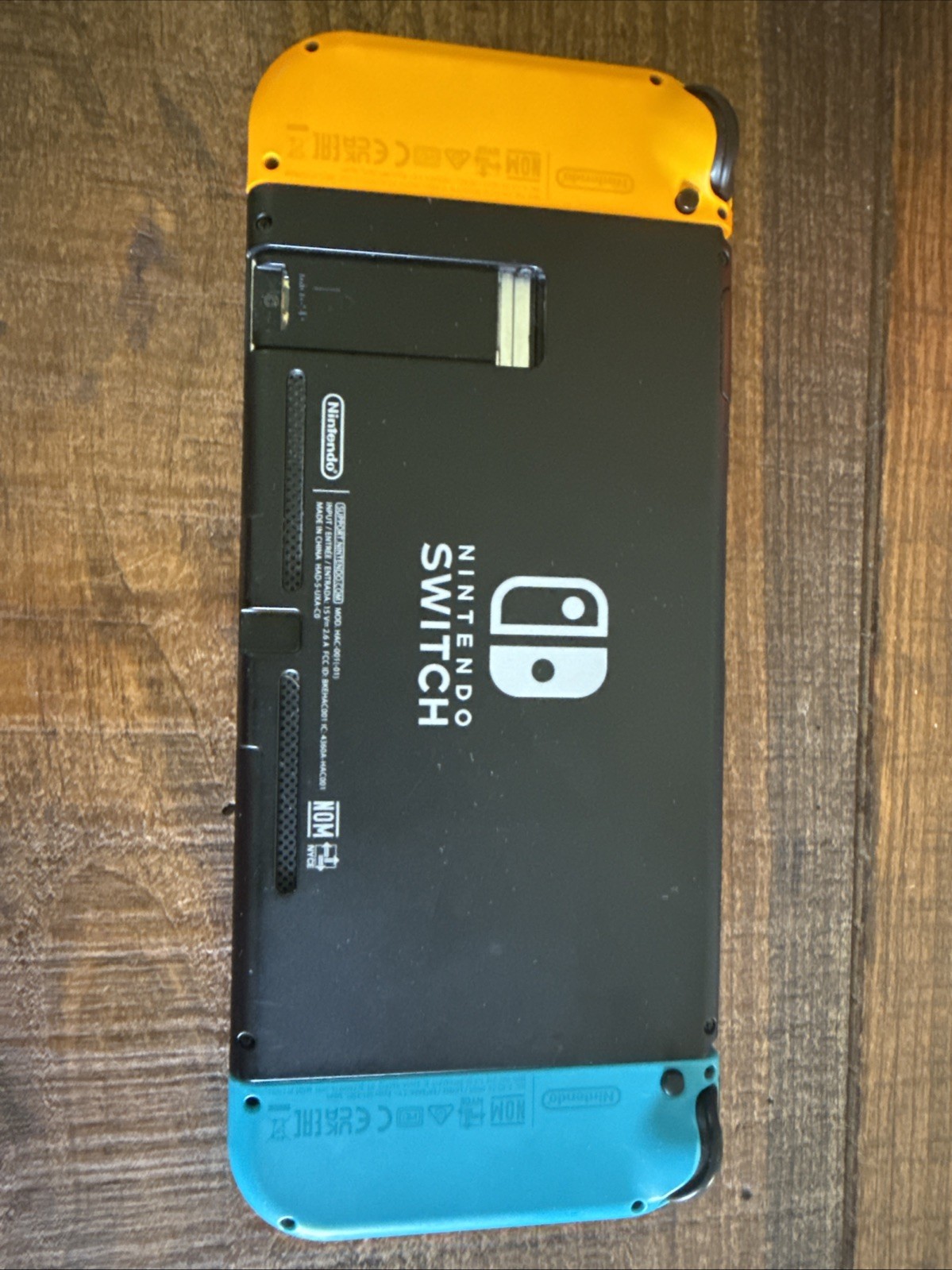 Nintendo Switch HandHeld Orange And Blue Joy Cons