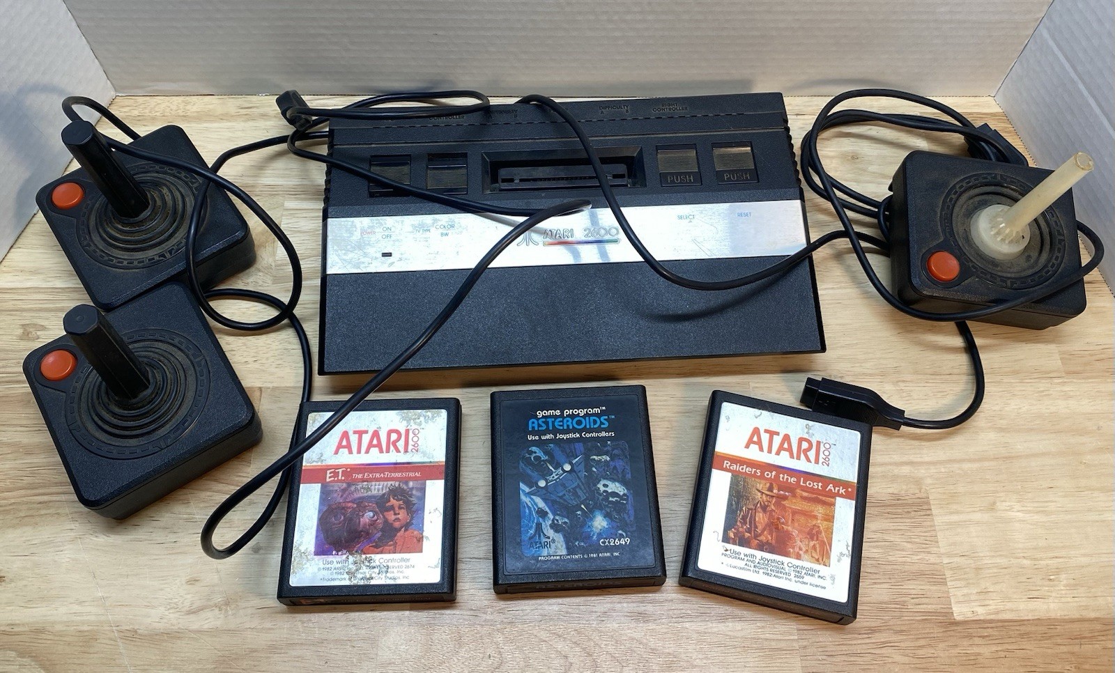 Atari 2600 Console with Games Asteroids ET Raiders of the Lost Ark