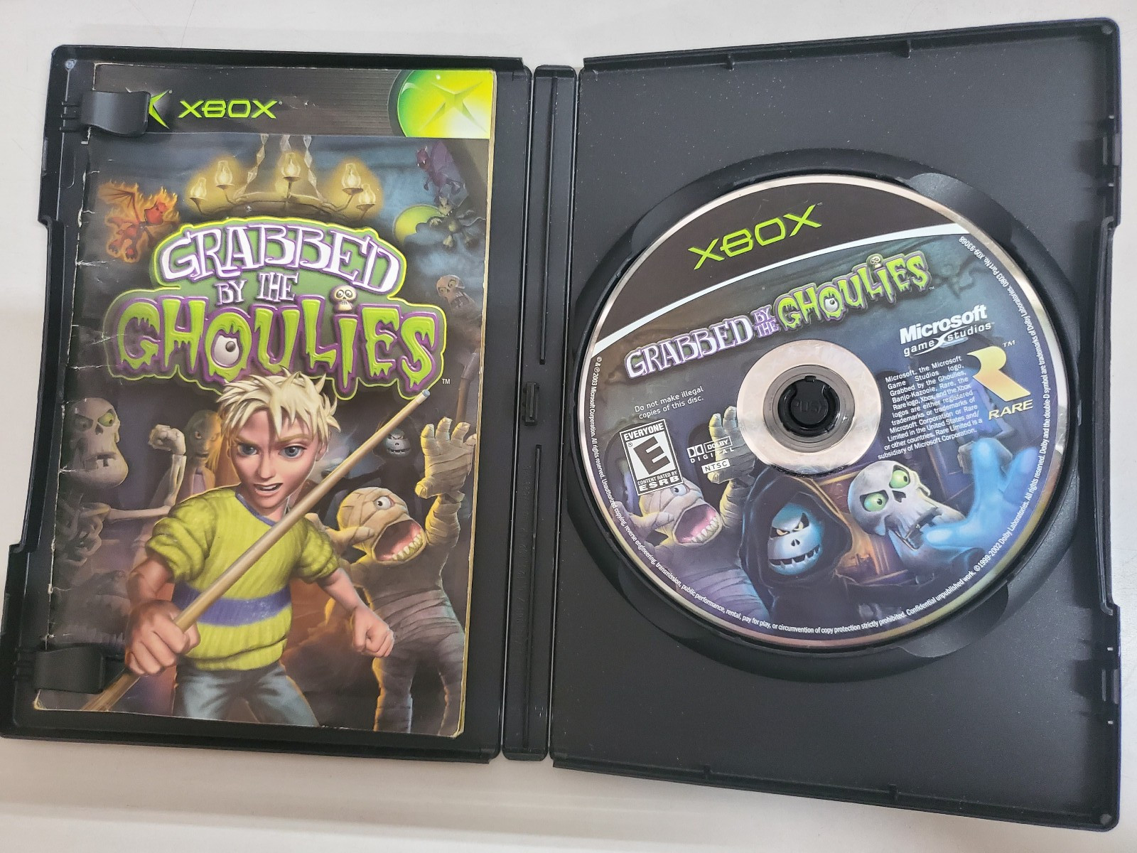 Grabbed by the Ghoulies( Original Xbox) w/ manual but no cover art Tested