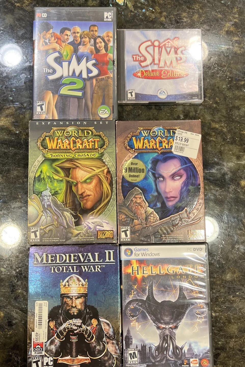 6 PC DVD-Rom Games Hellgate, Medieval II Total War, World Of WarCraft, Sims Lot