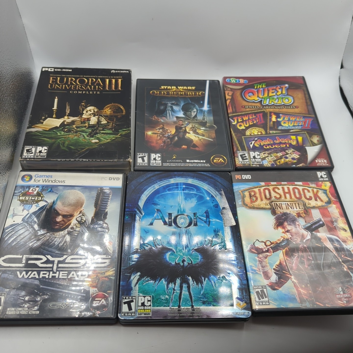 22 PC Videogame Lot Crysis, Lotr, BioShock, Prince Of Persia, AION, Dirt, & More