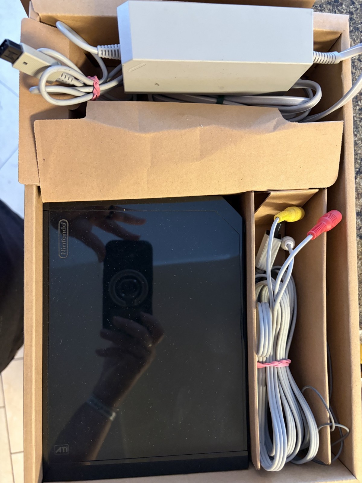 Nintendo Wii black console with cables