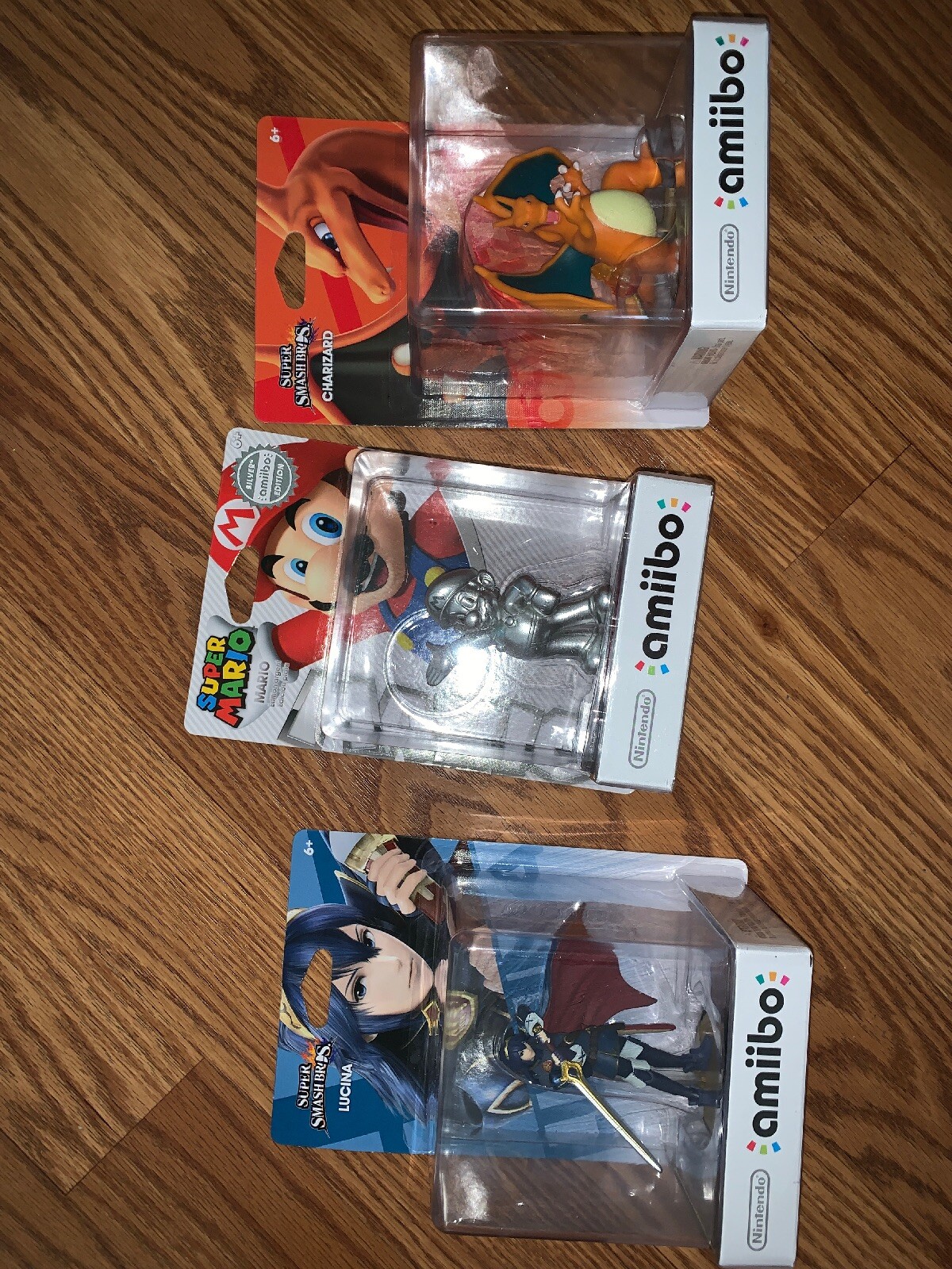 Amiibo Lucina, Mario Silver Edition, Charizard No Returns Accepted