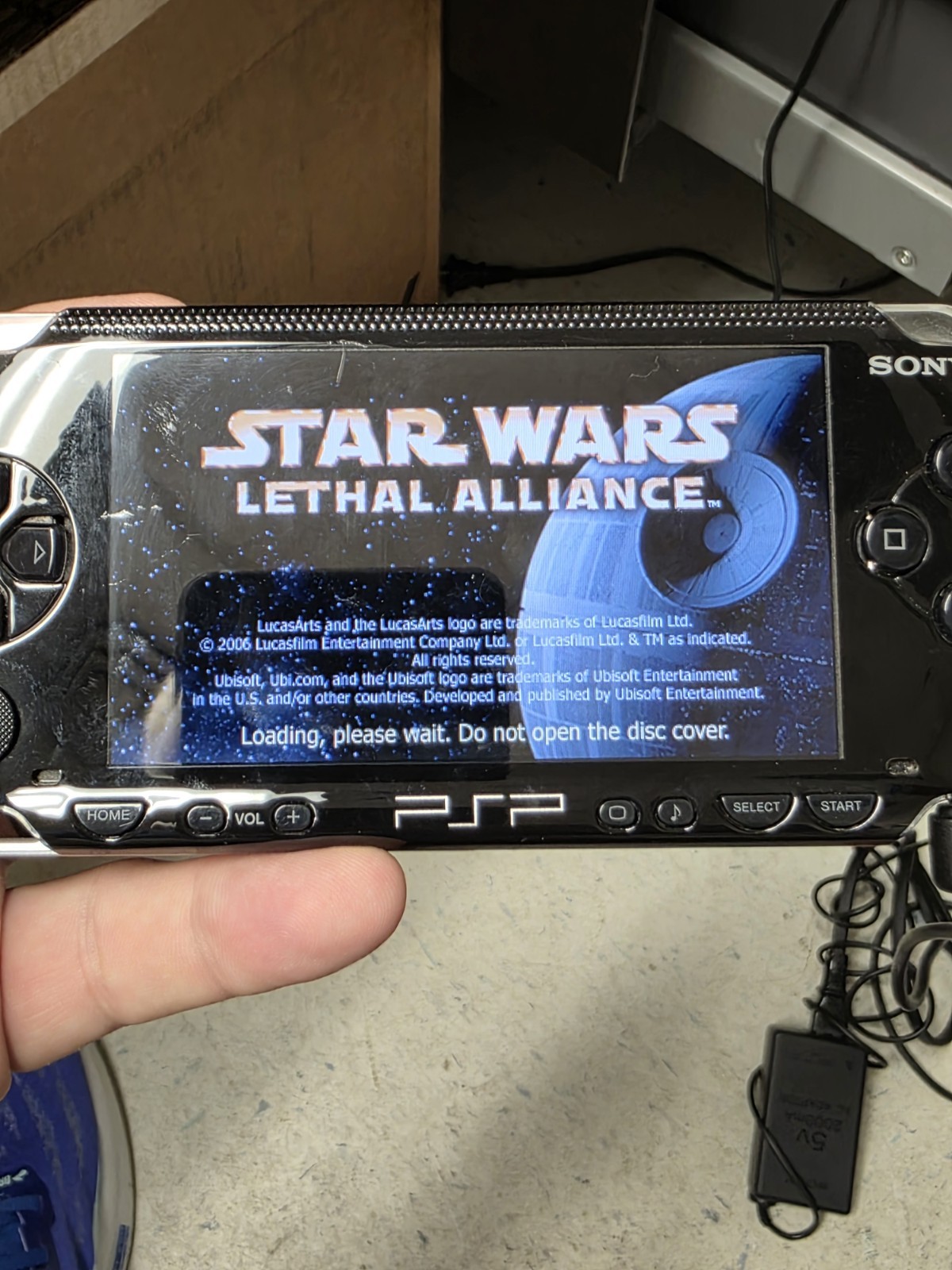 Sony PlayStation PSP 1001- Black W/Star Wars Lethal Alliance & Charger Tested