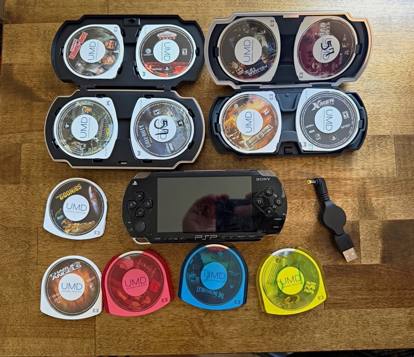 Sony PSP-1001 Black Handheld Console Wi-Fi, USB Cable & UMD Games Bundle