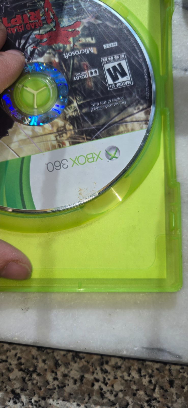 pre-owned copy of the video game Dead Island: Riptide for the Xbox 360 platform