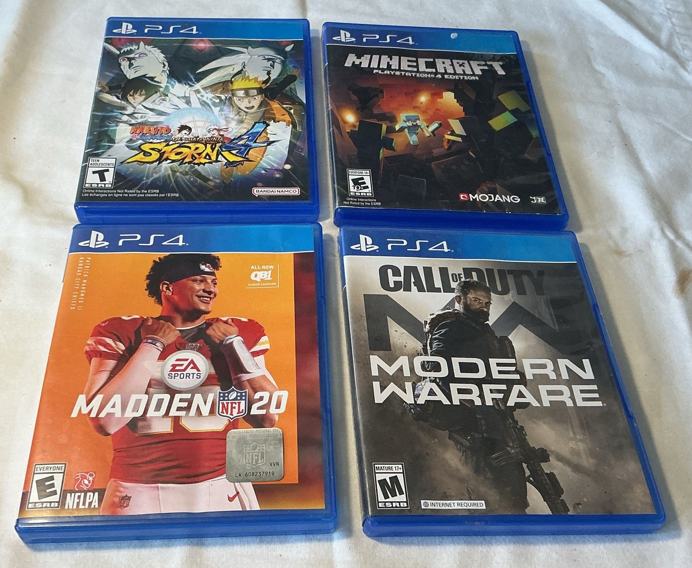 4 Play Station 4 Video Games.madden 20,modern Warfair,naruto Storm ,mind Craft.