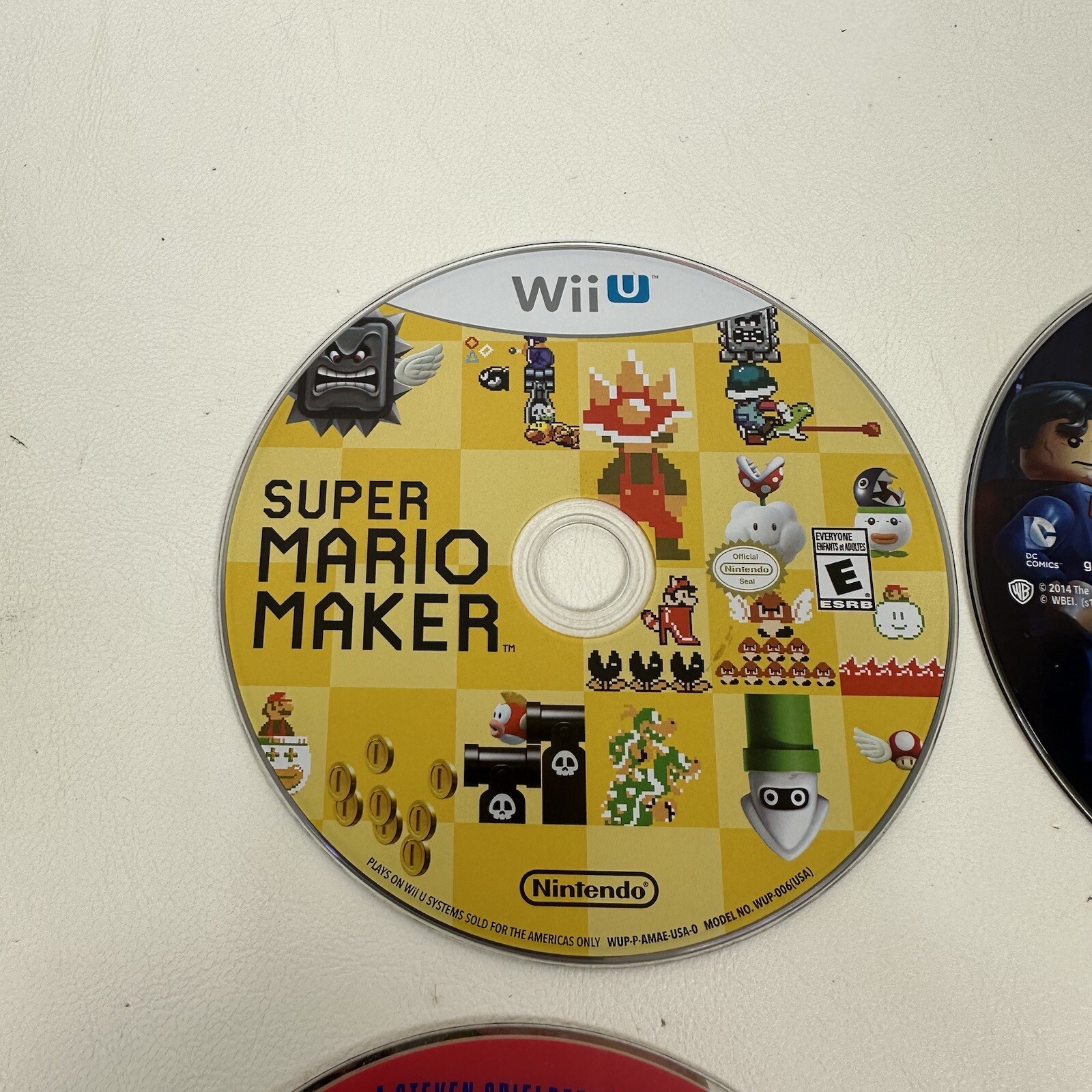 Wiiu Wii lot of 4 games Mario Maker Lego Batman Boom Blox Disney Infinity