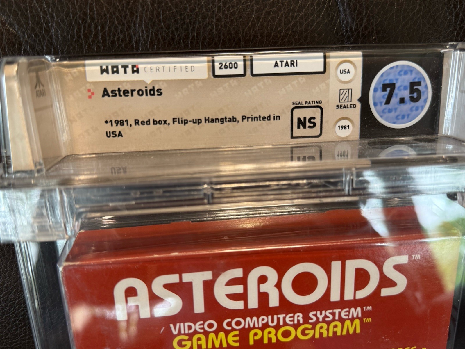 Atari 2600 Asteroids (1981 Red Box Hangtab) WATA 7.5 Sealed – Rare Early Print