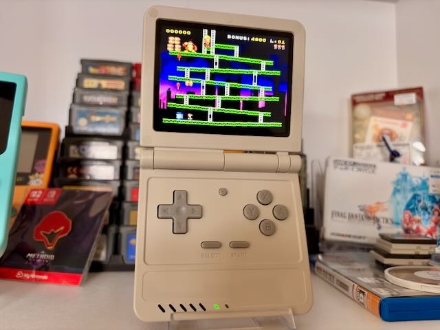 Powkiddy V90S Clamshell Retro Handheld Game Console – Sleek Grey Finish