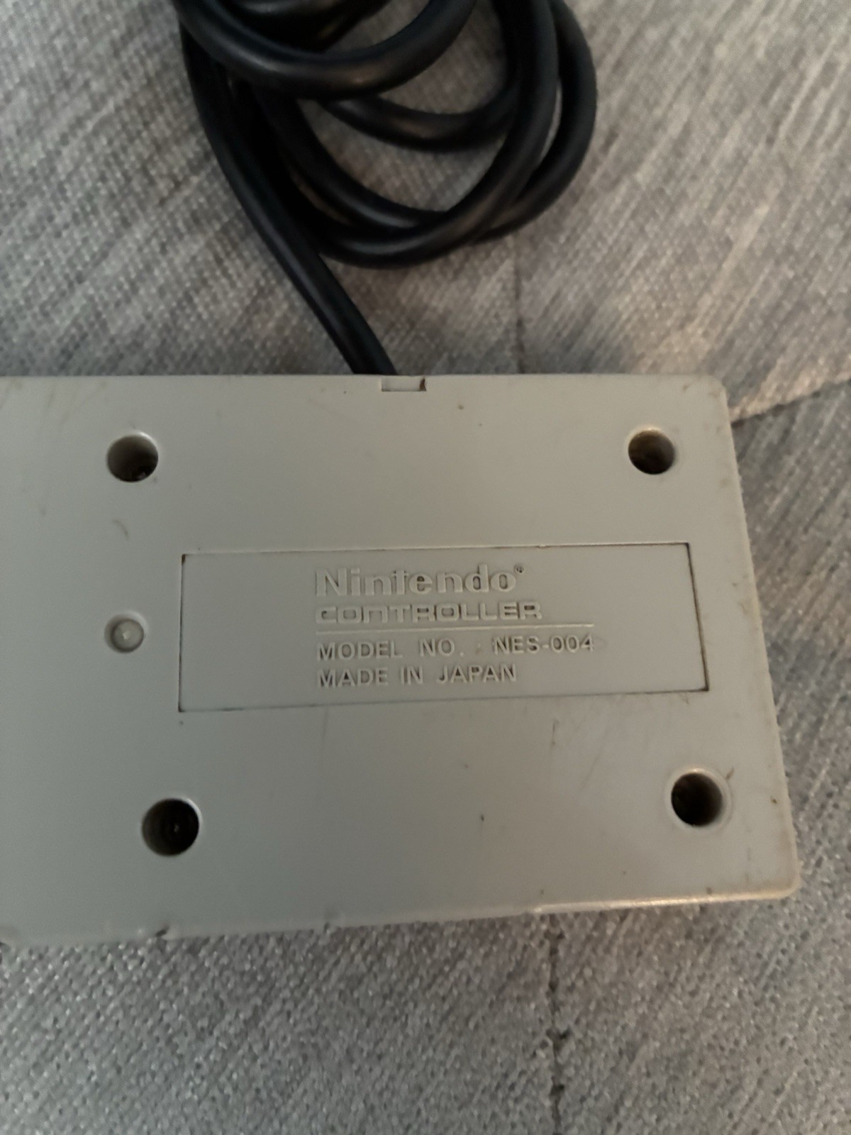 2 Vintage Nintendo NES OEM Controllers, RF Adapter, And Manual.