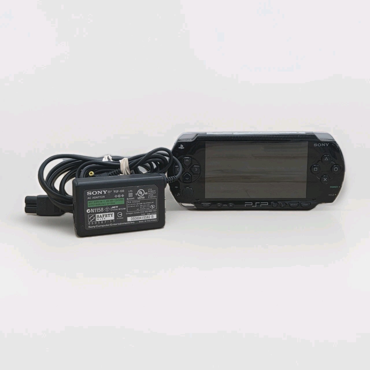 Sony PSP-1001 PlayStation Portable – Black with 8gb Memory Stick Duo & Pwr Cable