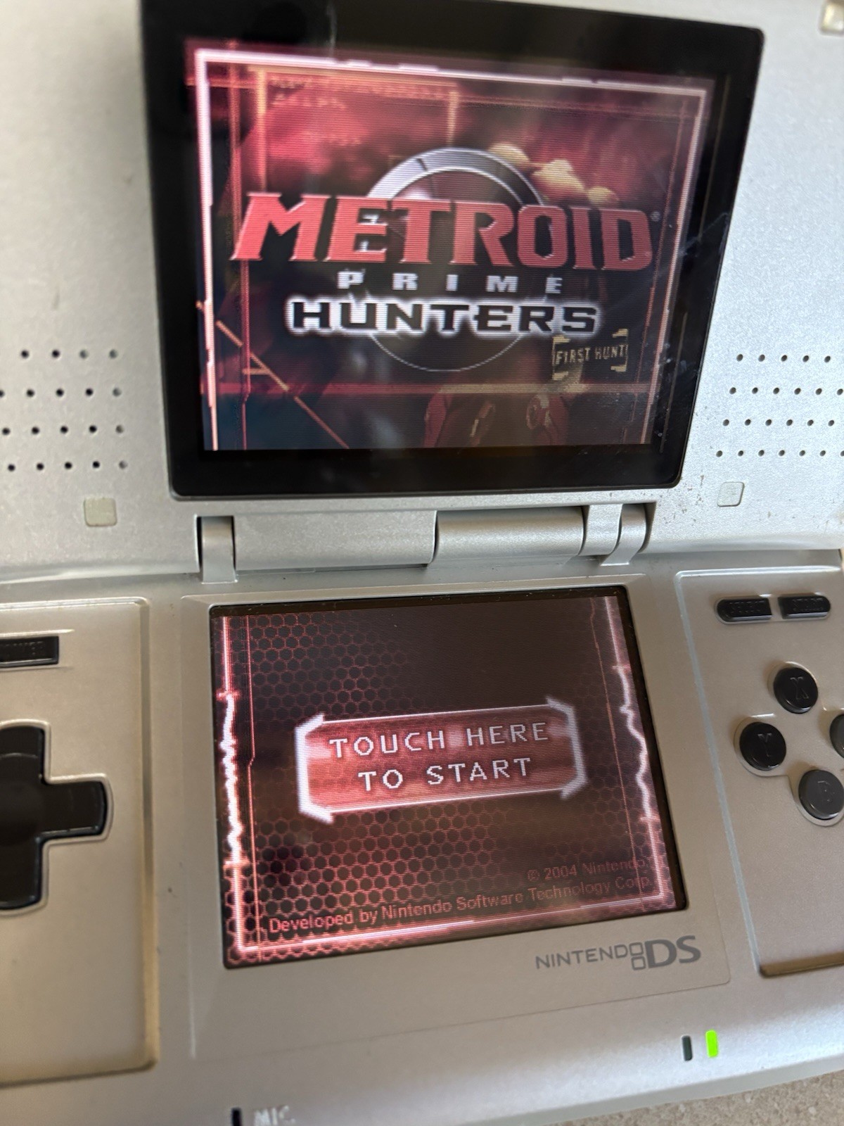 Silver Nintendo DS Handheld System With Metroid Prime Hunters First Hunt Tested