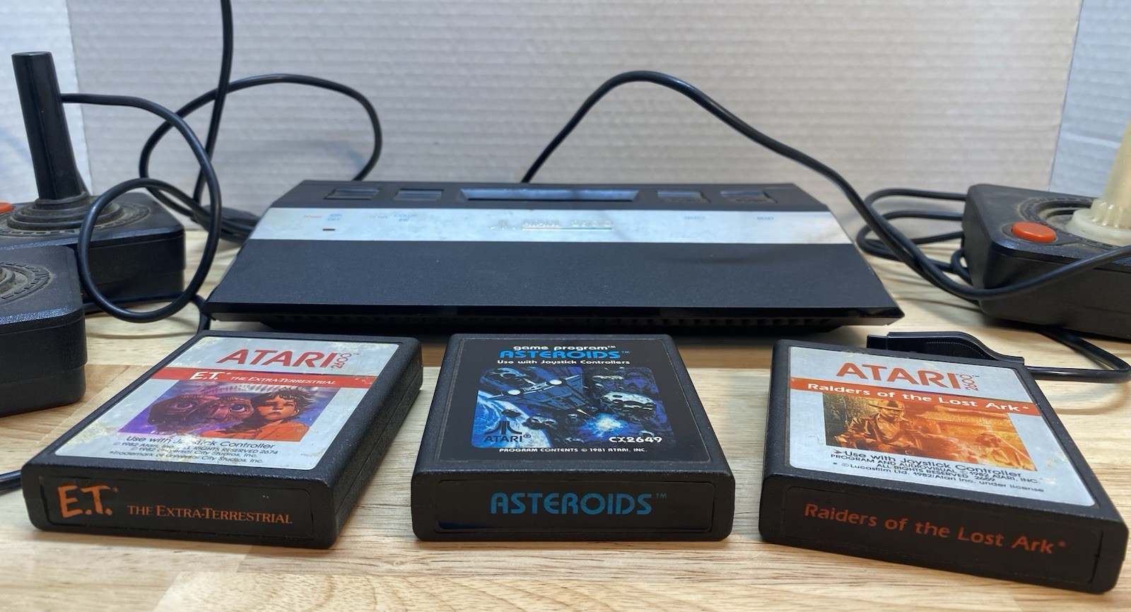 Atari 2600 Console with Games Asteroids ET Raiders of the Lost Ark