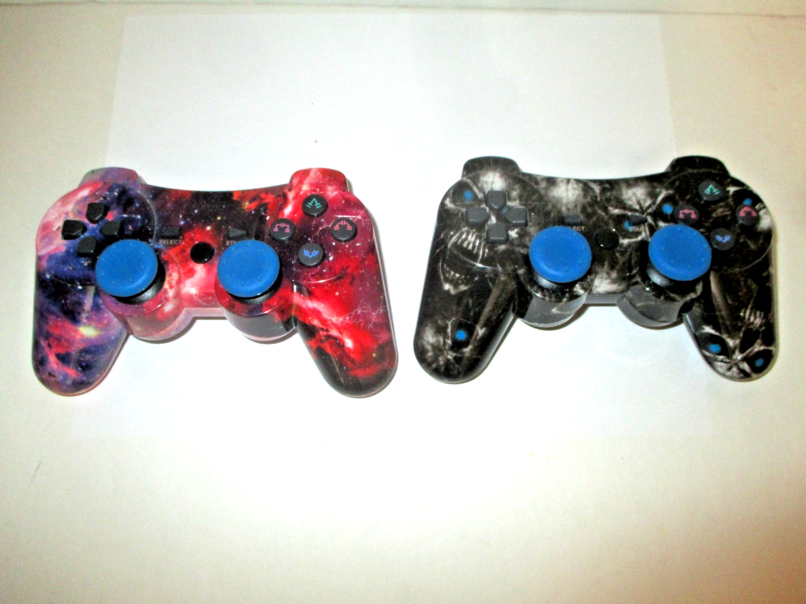 PAIR PLAYSTATION 3 PS3 3RD PARTY CONTROLLERS BLACK SKULL RED COSMOS+CORDS AS IS