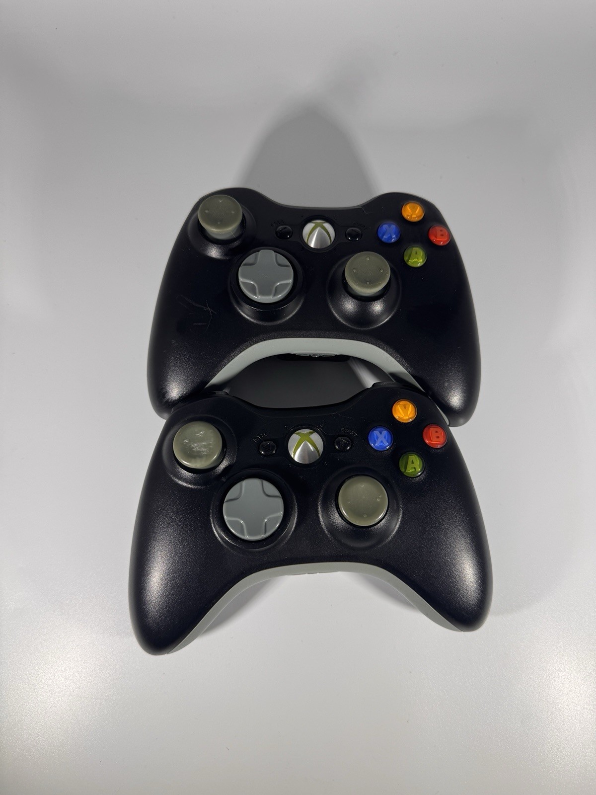 Lot of 2 Microsoft Xbox 360 Black/Grey Wireless ControllerOEM – As-Is