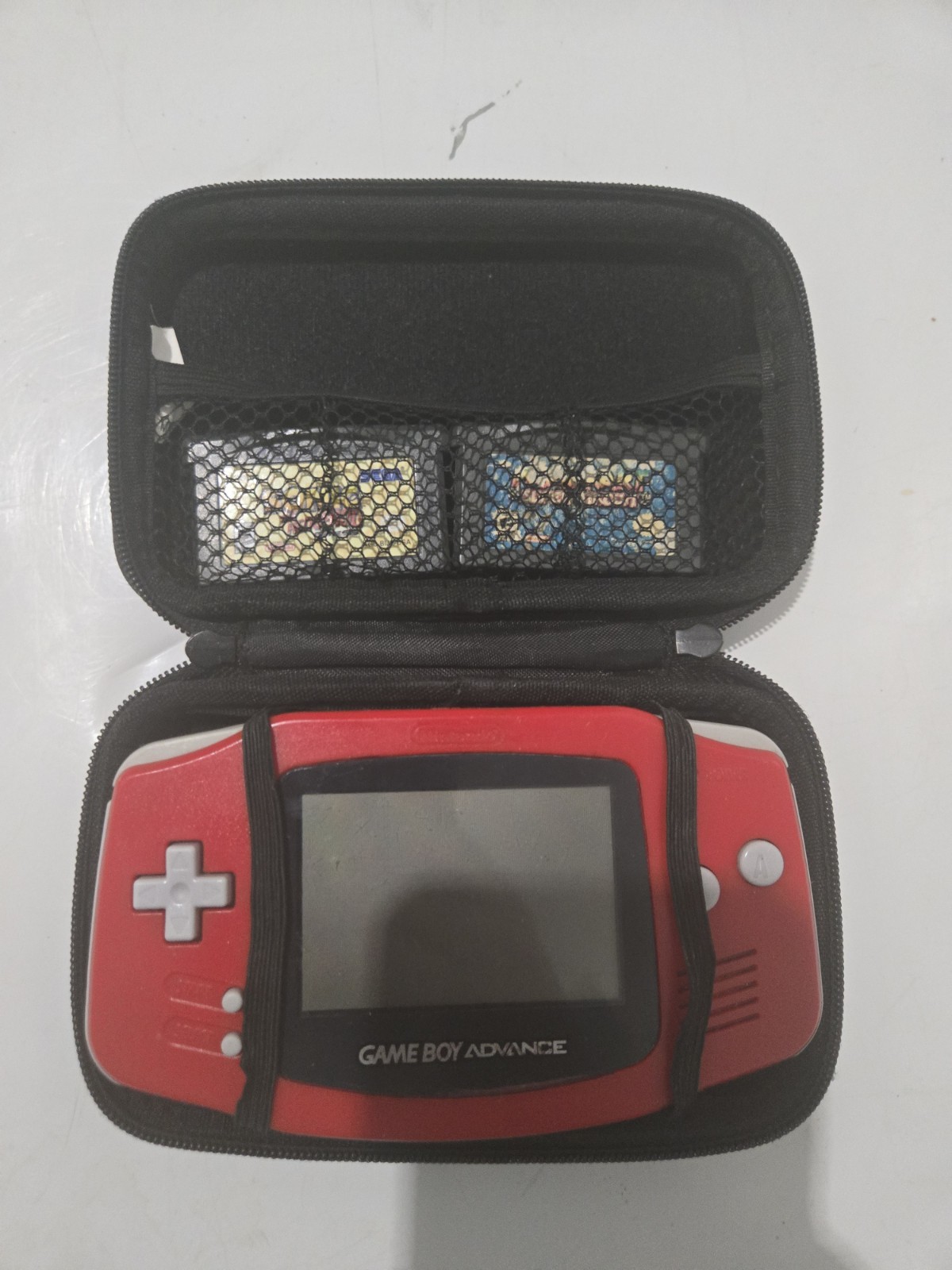 red gameboy advance with 2 games and case tested