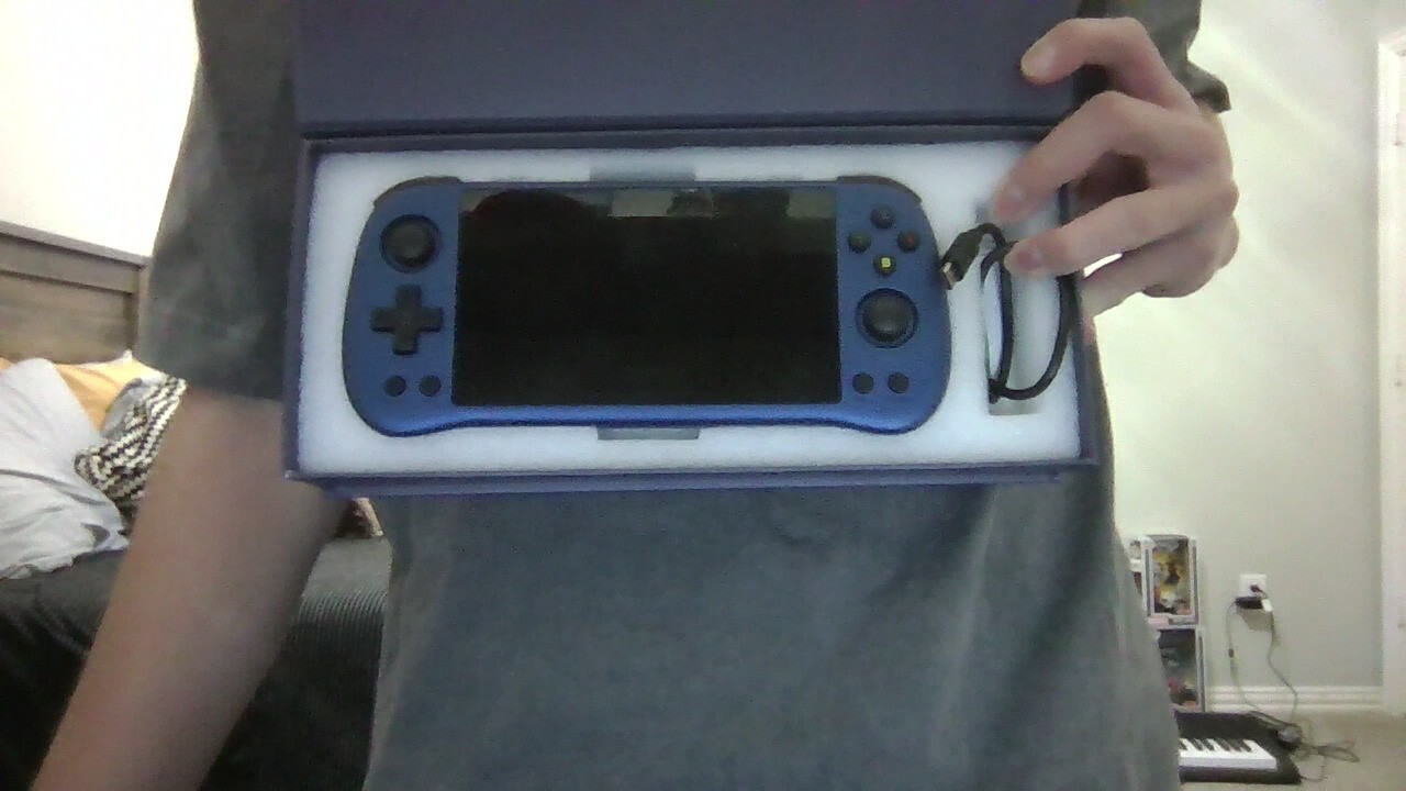 Powkiddy x55 5.5 inch 144 gb card included with charger and in good condition