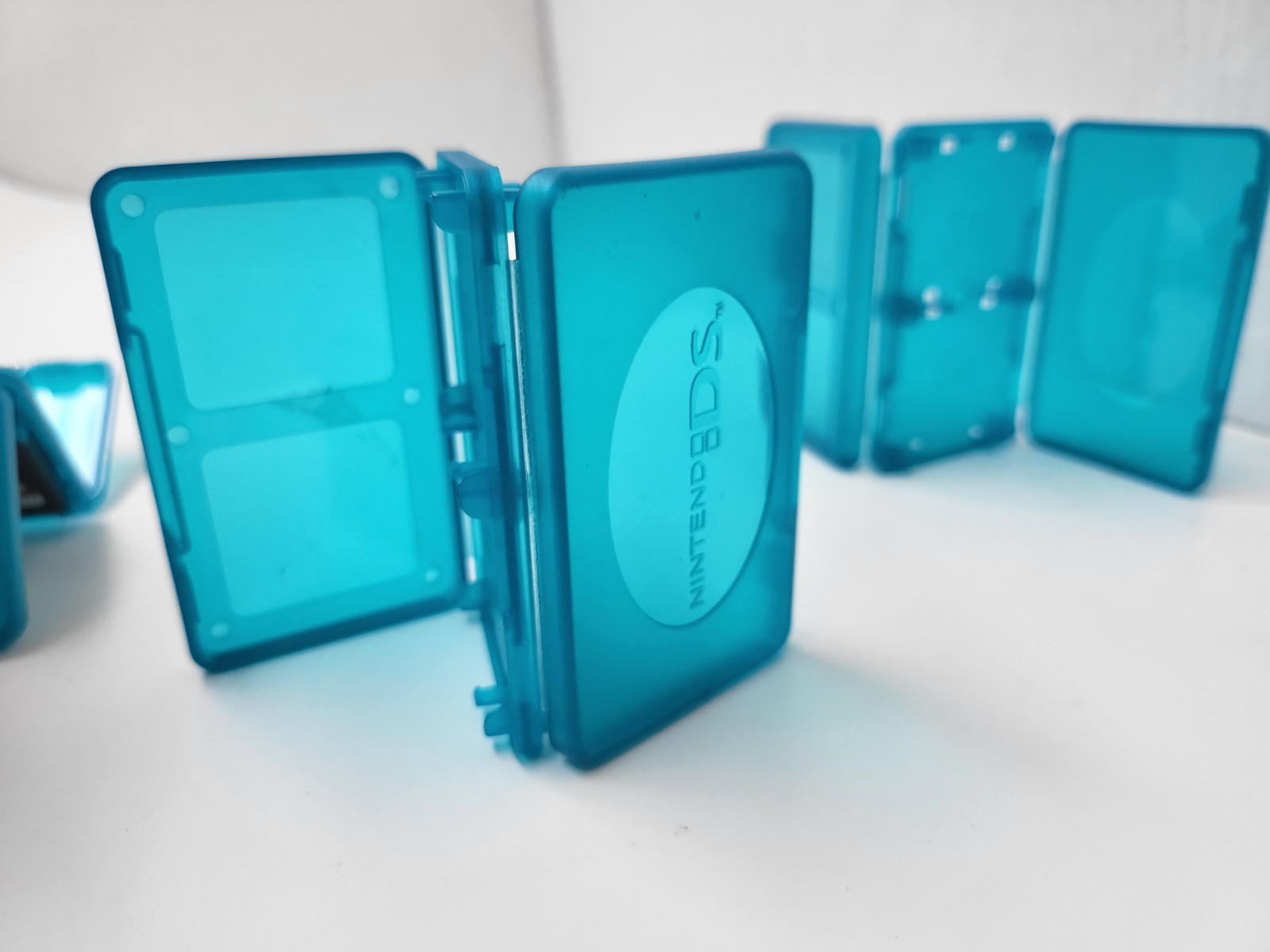 3 NEW OFFICIAL NINTENDO DS CLEAR BLUE 4 GAME CARTRIDGE CASE HOLDER 12 TOTAL #G5