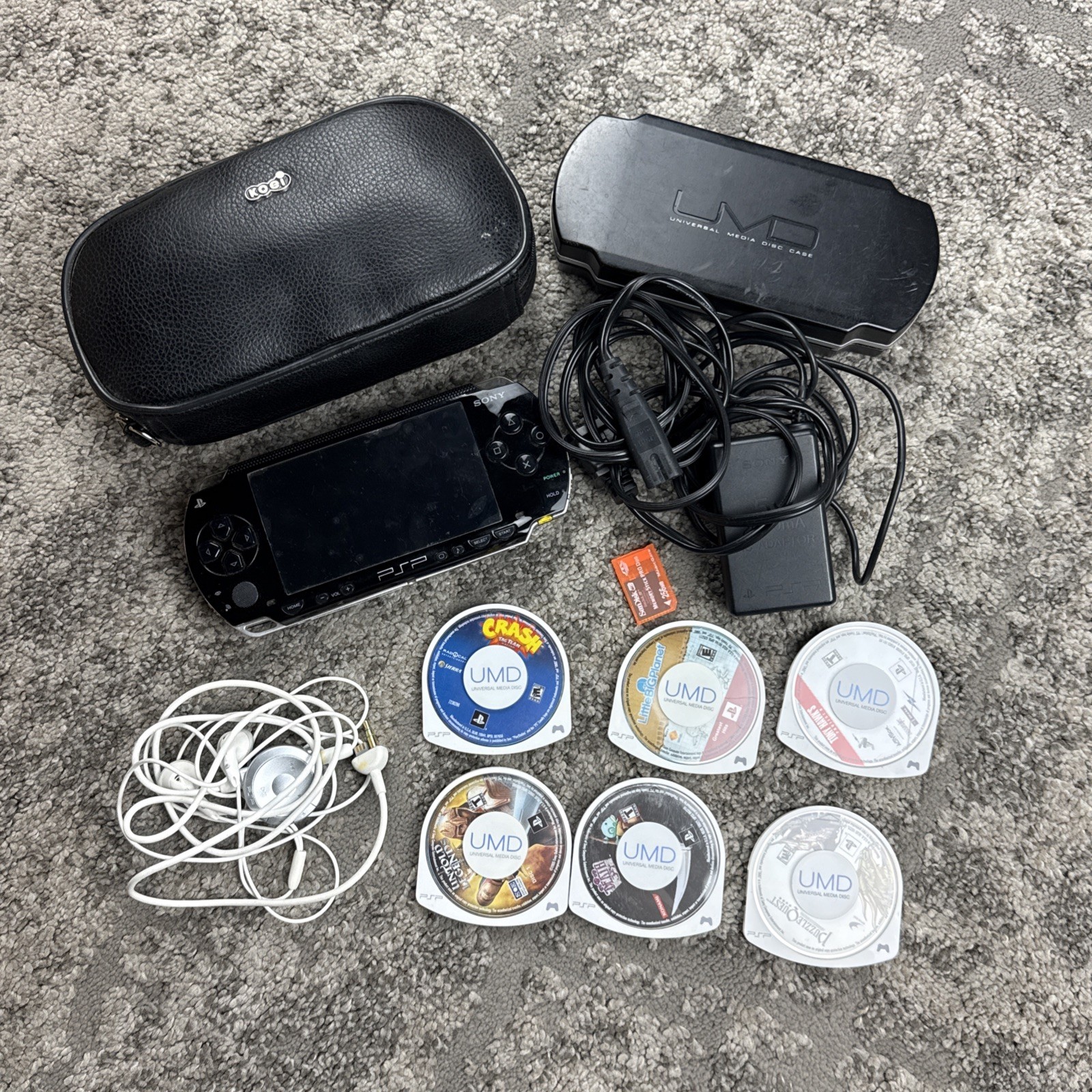 Sony PSP-1001 Black Handheld Console w/ Case, Charger & 6 Games Bundle