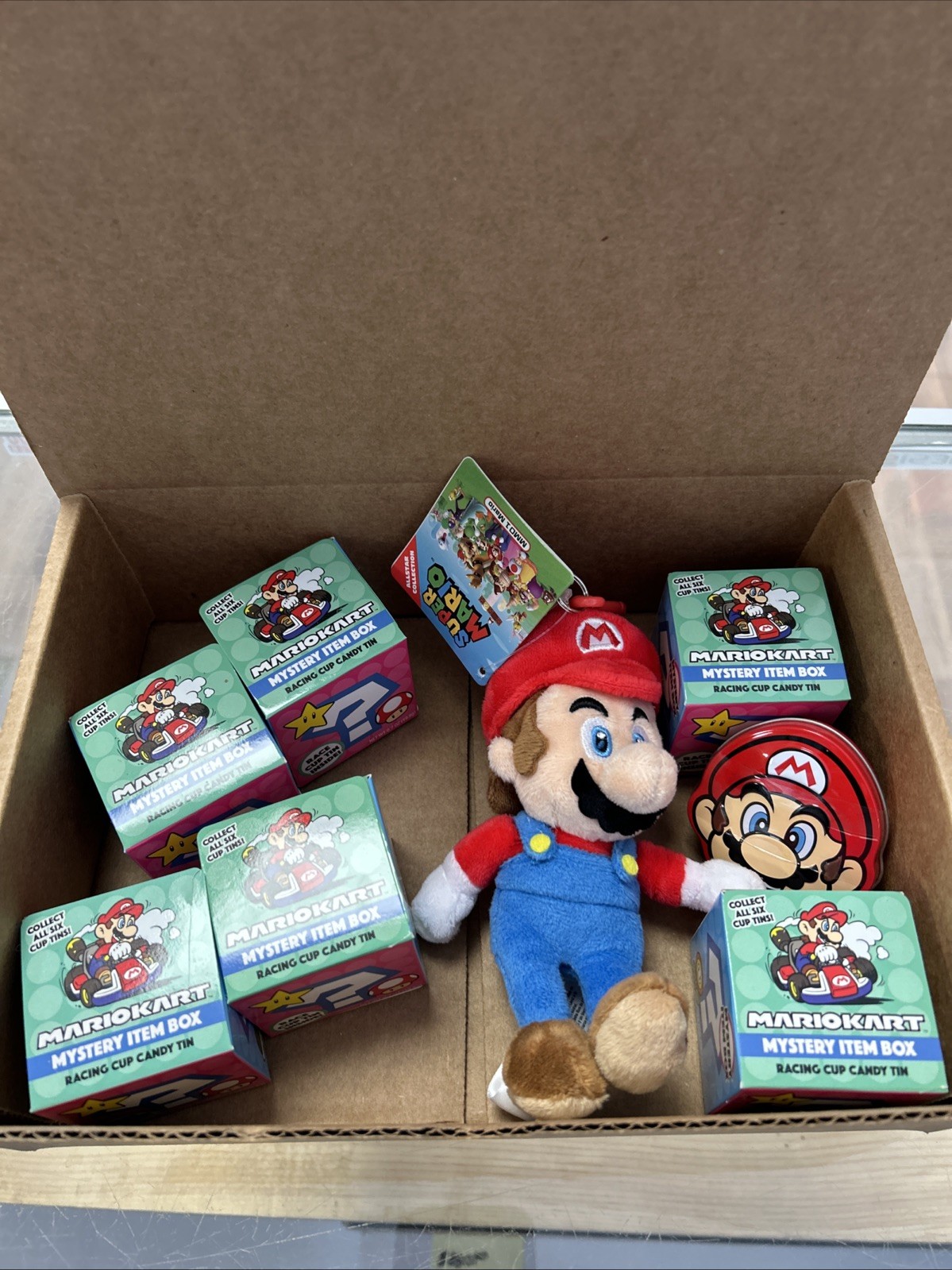 Mario Merch Lot. 6 New Mystery Boxes. 1 New Mario. 1 New Tin.