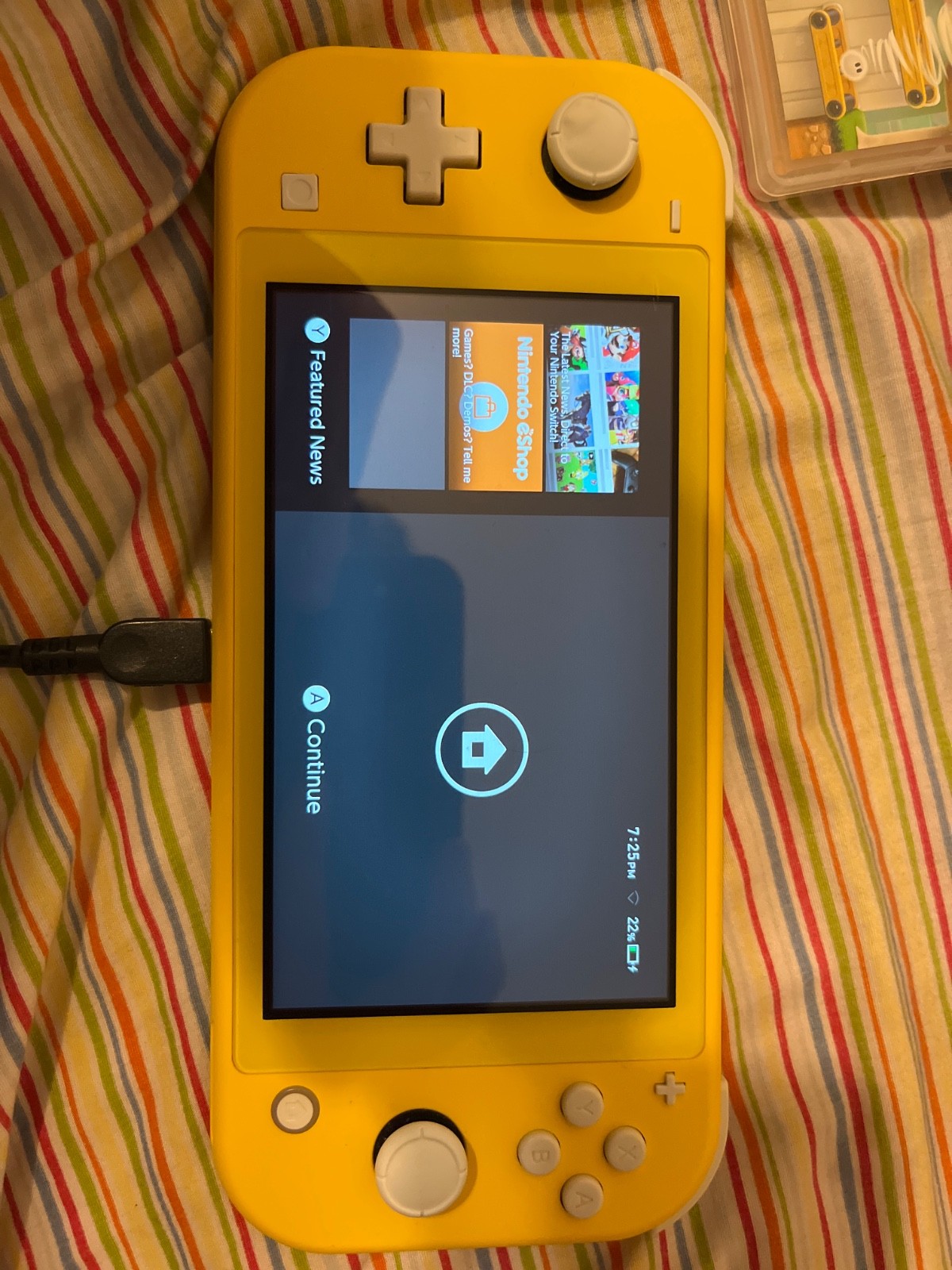 yellow nintendo switch lite with case and games