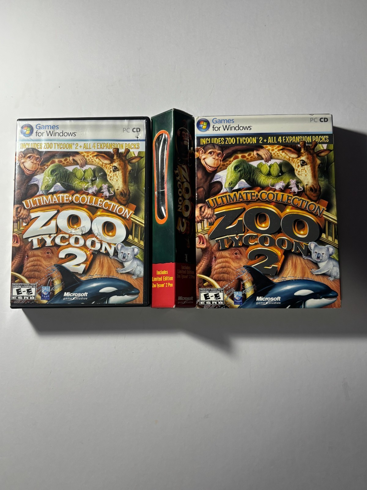 Lot of Zoo Tycoon games and pen