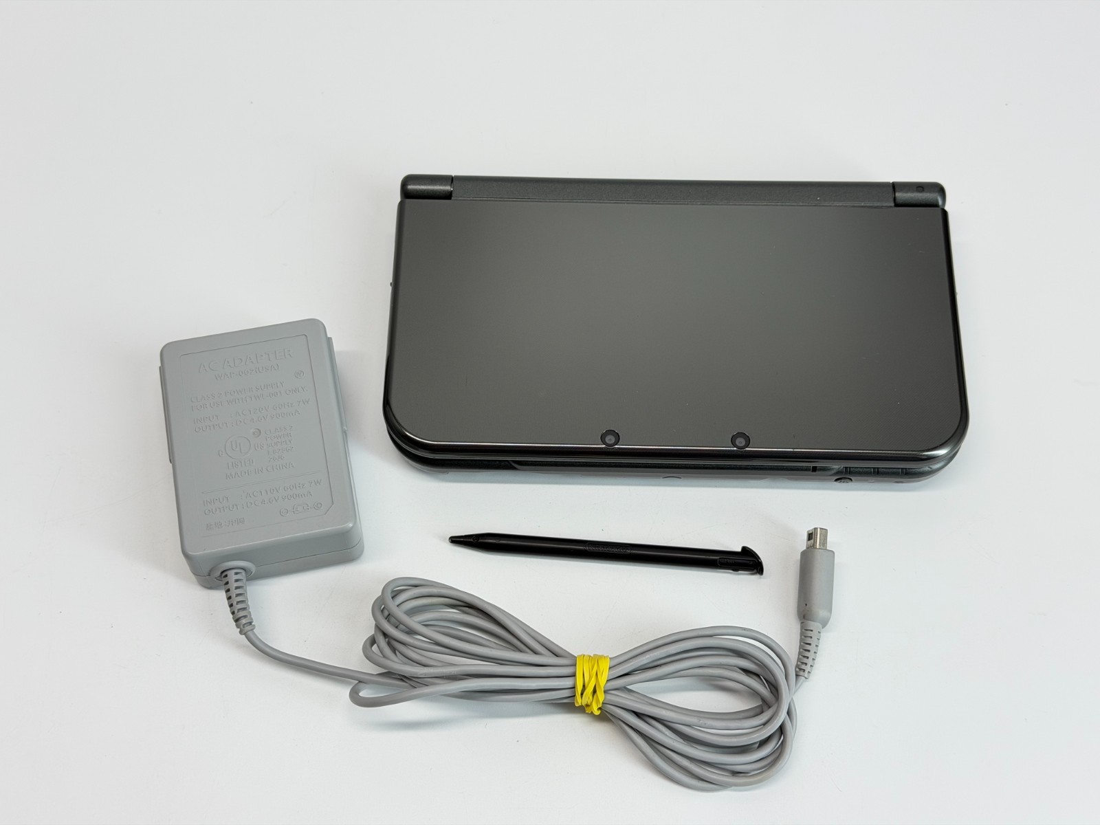 Nintendo New 3DS XL Metallic Black Handheld System *Screen has Yellow Line*