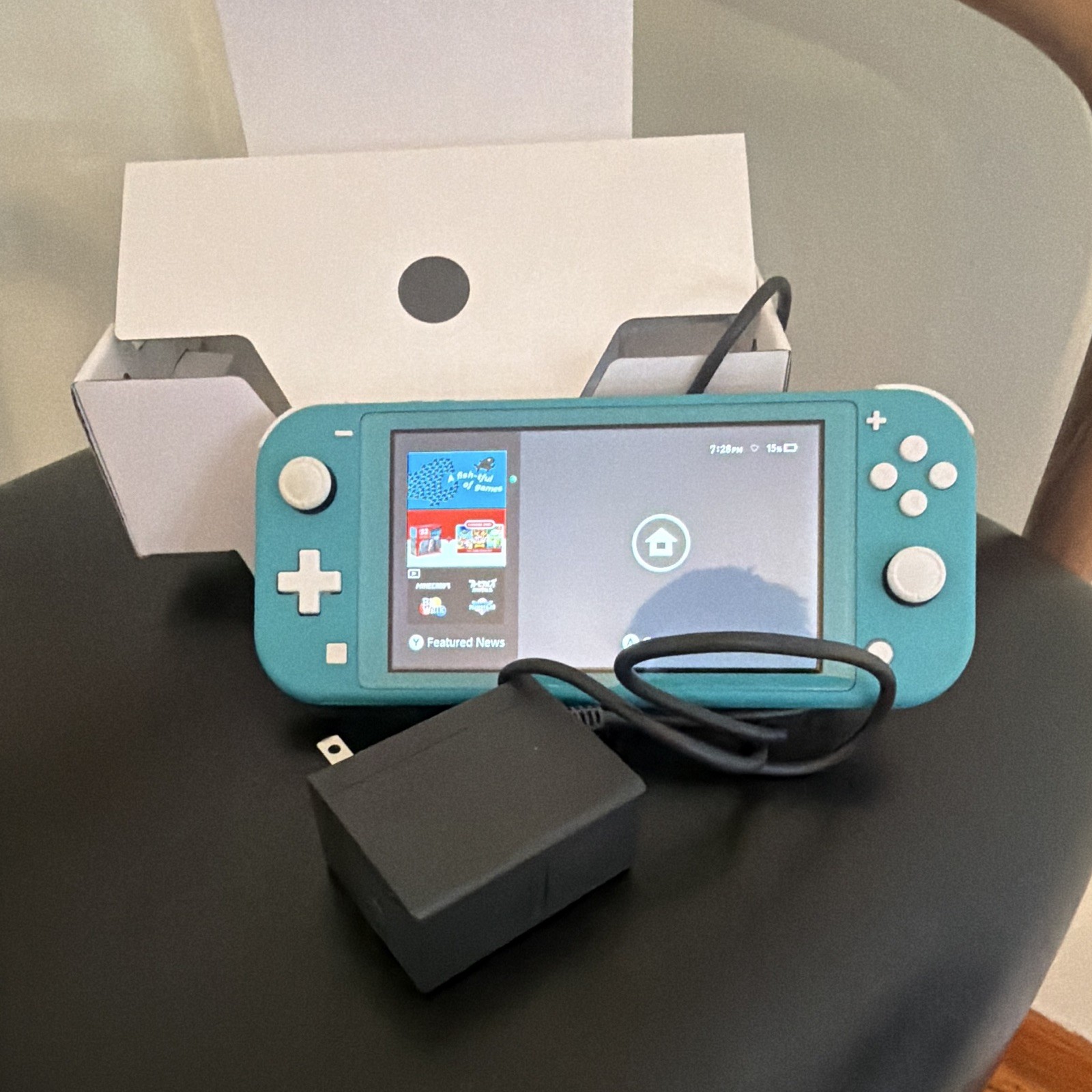 Nintendo lite handheld console w/ charger barely used owned for 1 month