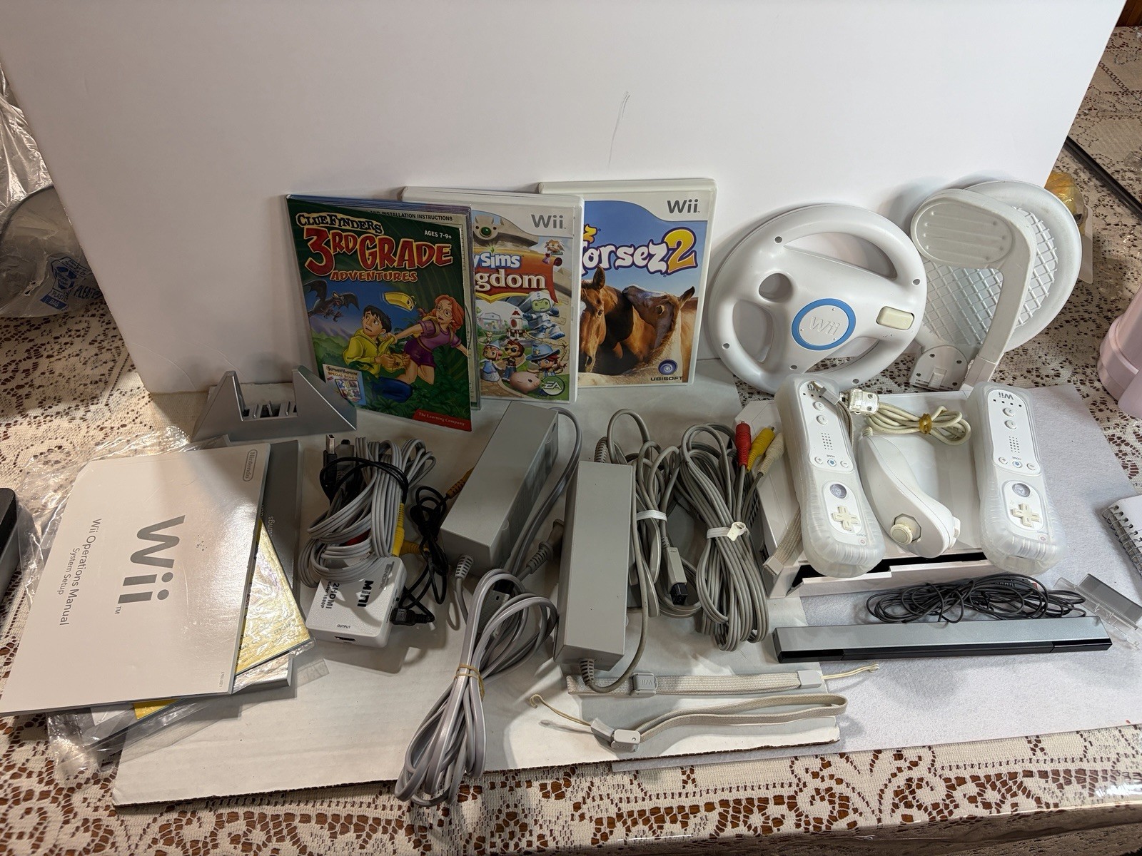 Wii video game console bundle with multiple accessories and games (untested)