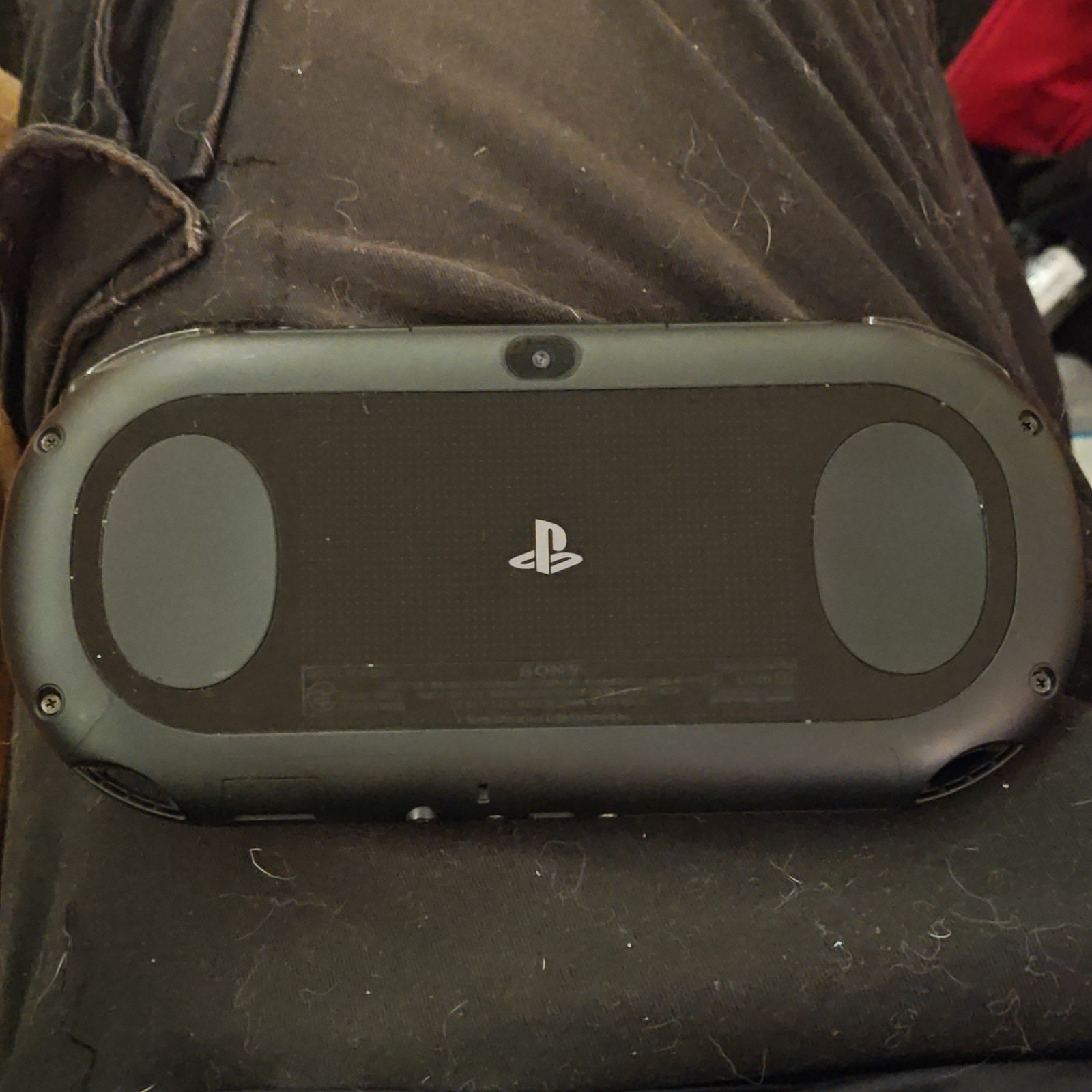 Sony PS Vita with games, Carrying Case, charge cable, and Thumb Grips.