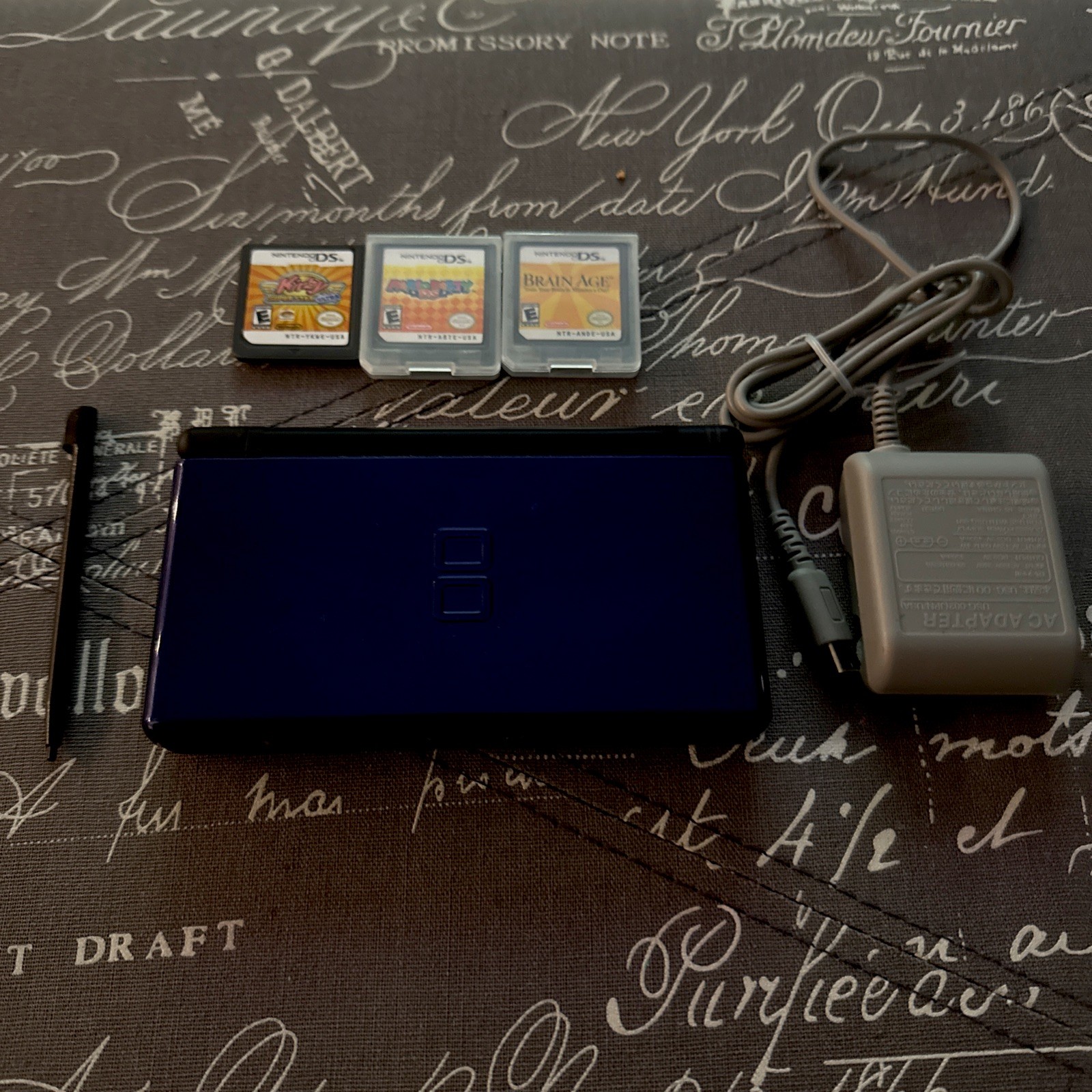 Nintendo DS Lite With Charger and Stylus Navy Blue. Three games included.