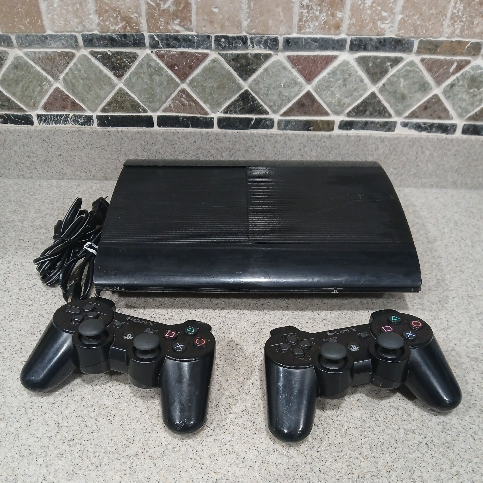 Sony PlayStation 3 PS3 Super Slim cech 4001B Black Console 2 Controllers