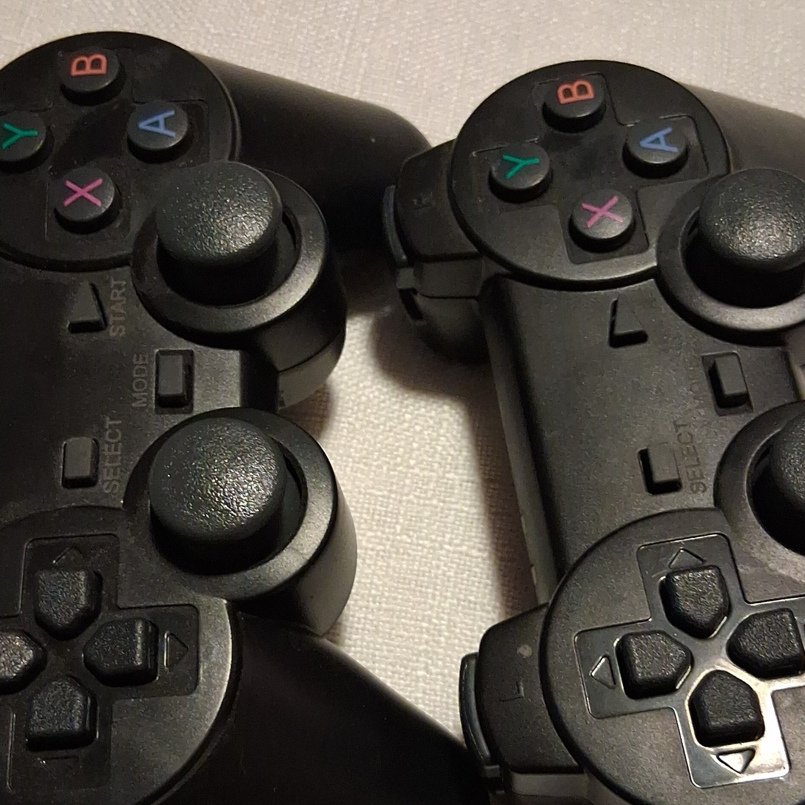 Lot of 2 Black Video Game Controllers with Dual Joysticks and XYAB Buttons