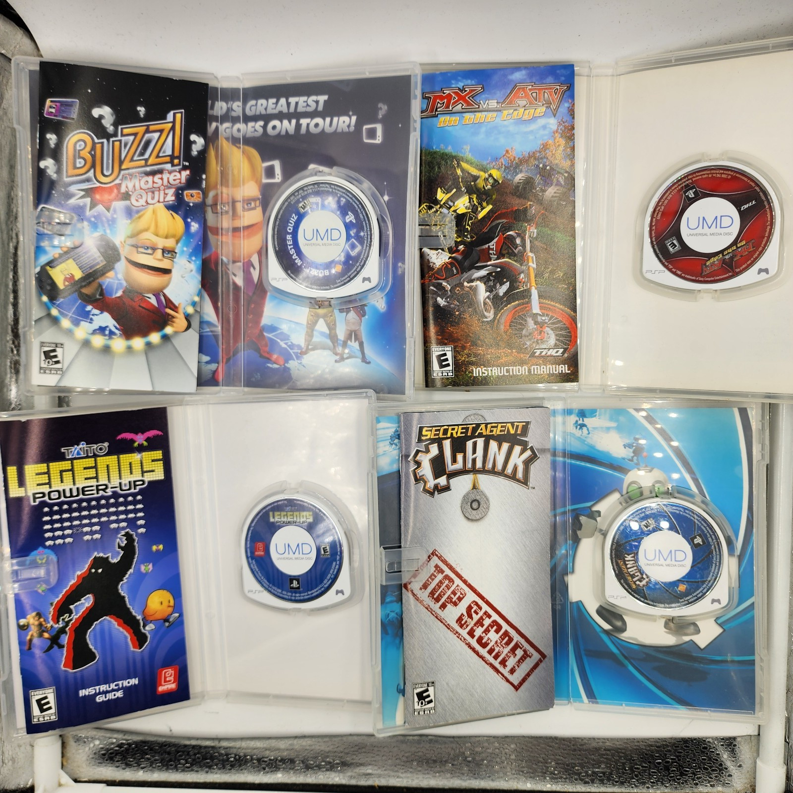 Lot of 16 Assorted PSP UMD Games w/ Manuals *pre-owned