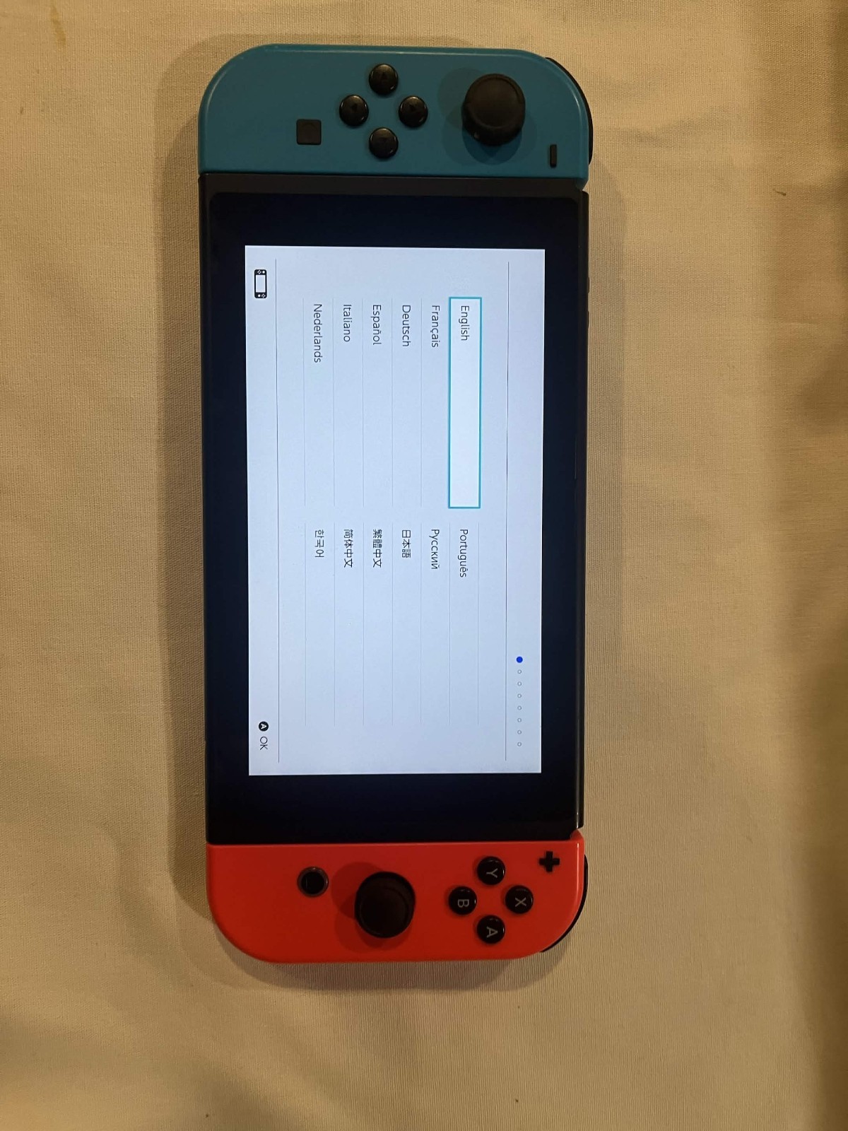 Nintendo Switch with accessories and box with red and blue joy cons