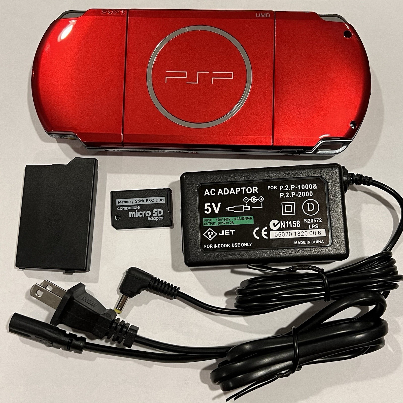 RADIANT RED PSP 3000 System w/ 8gb Memory Card, Charger, & Battery Bundle Import