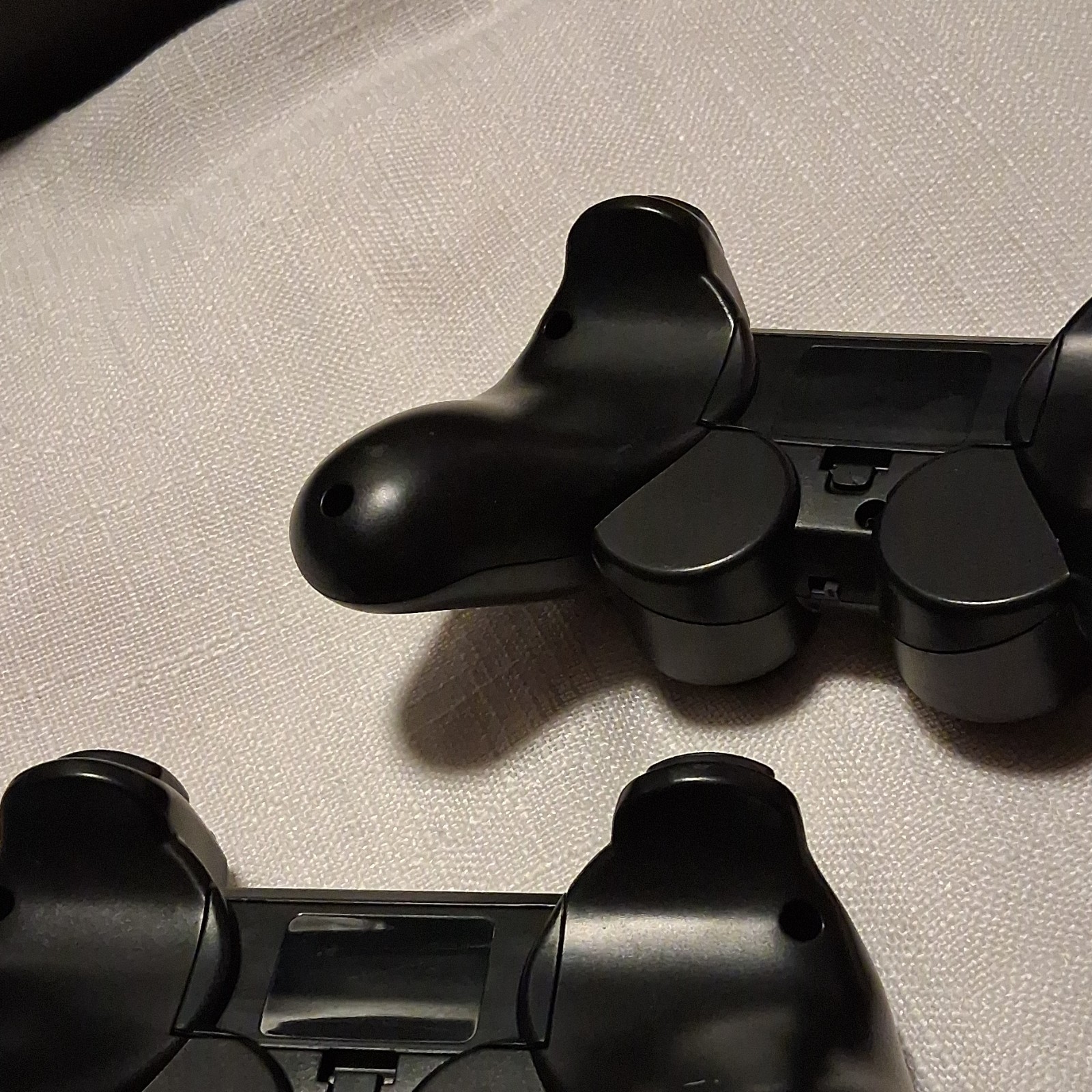 Lot of 2 Black Video Game Controllers with Dual Joysticks and XYAB Buttons