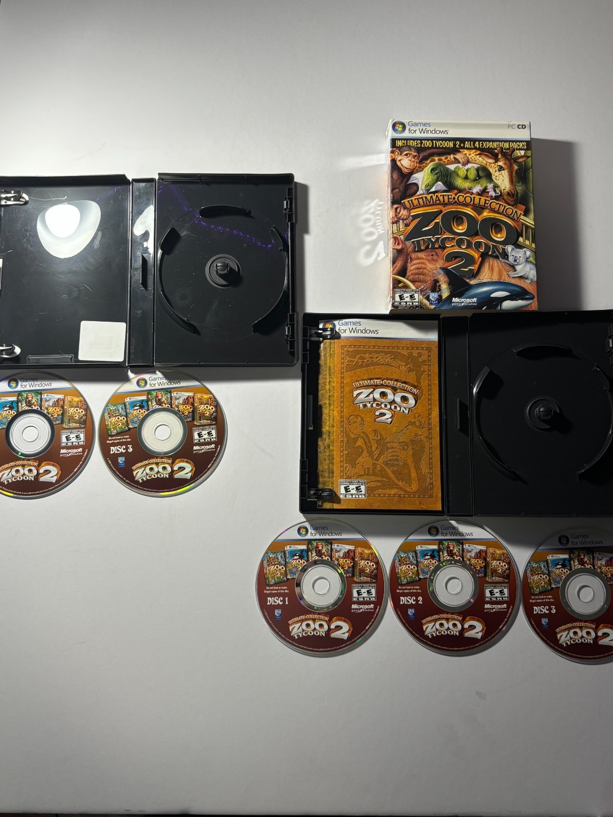 Lot of Zoo Tycoon games and pen