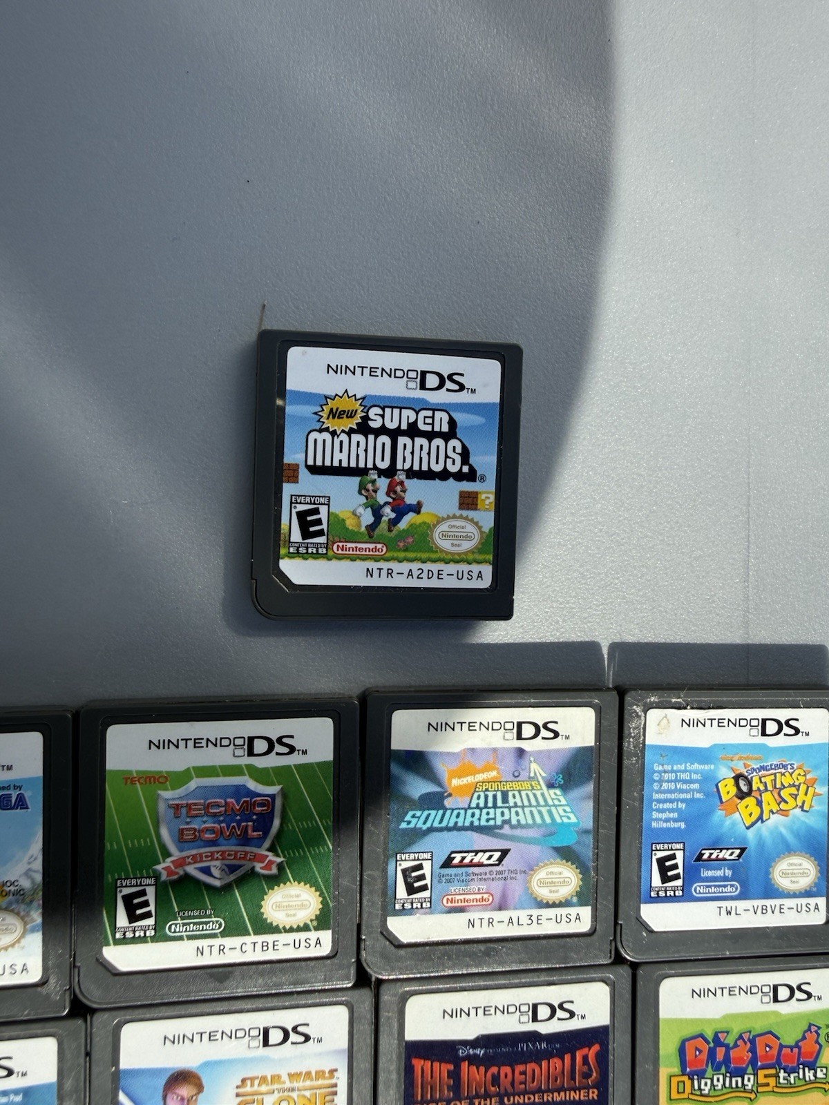 Nintendo DSi Lite Blue Console + Game Cartridge Lot (Mario, Star Wars, Batman)