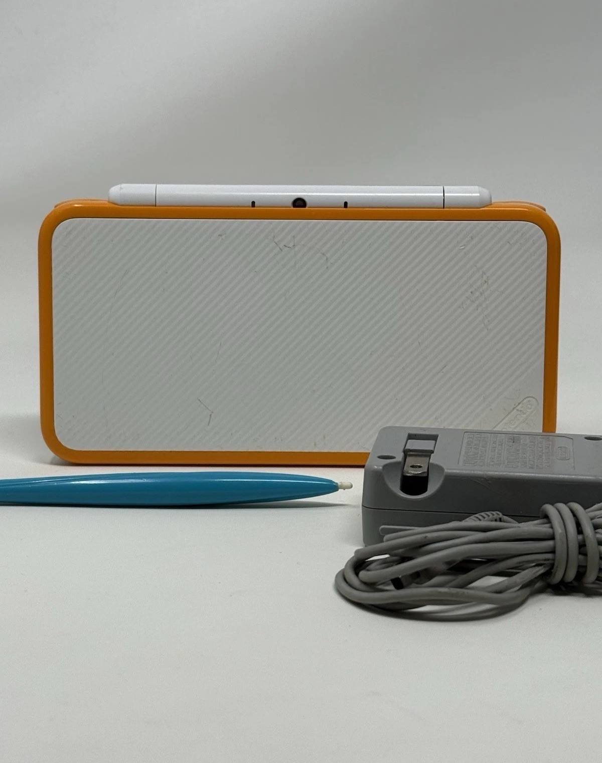 New Nintendo 2DS XL Orange White Handheld USA System w Charger Stylus and Extras