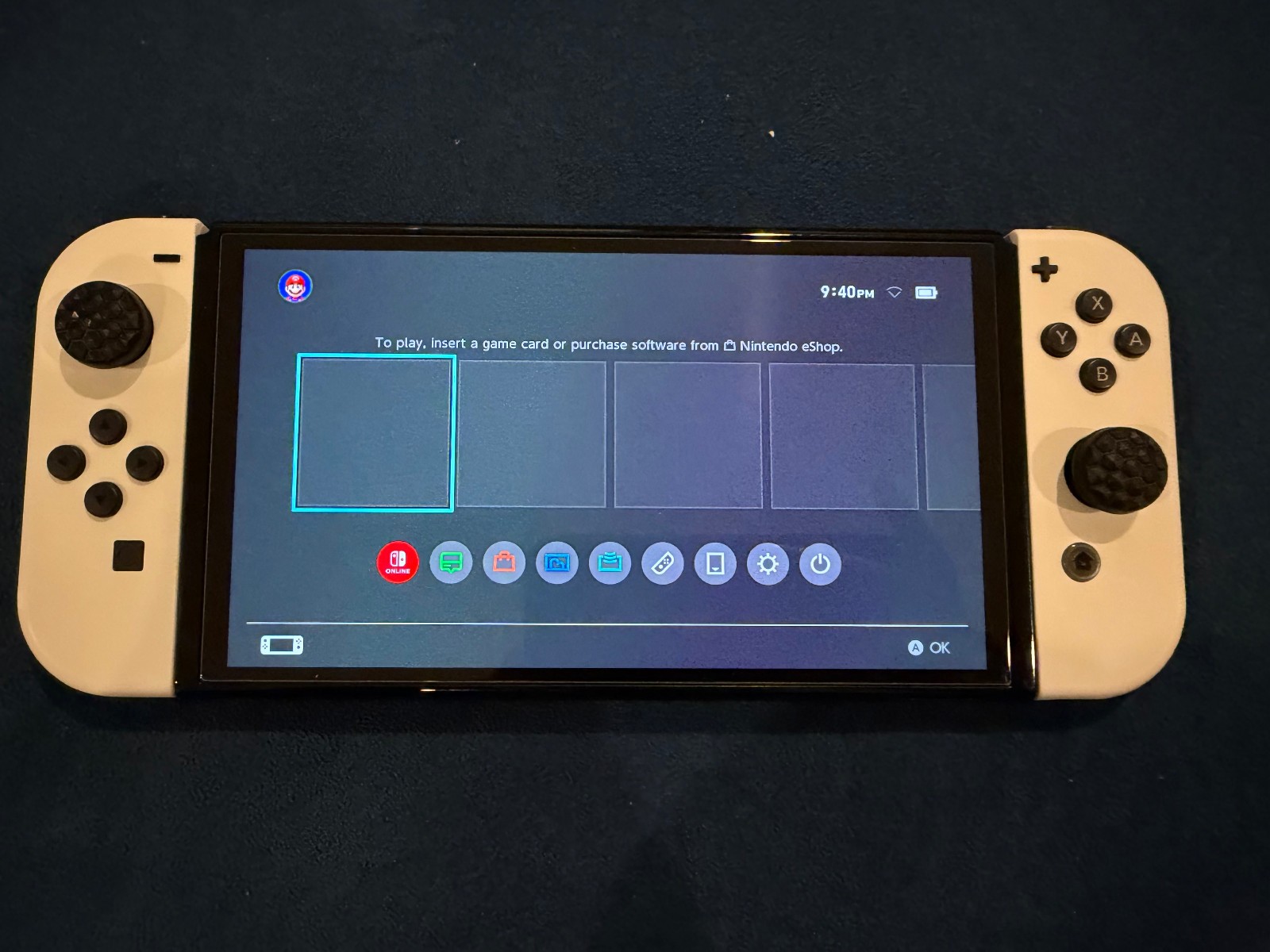Nintendo Switch Oled Edition (Comes w/ charging stand, carrying case and Game)
