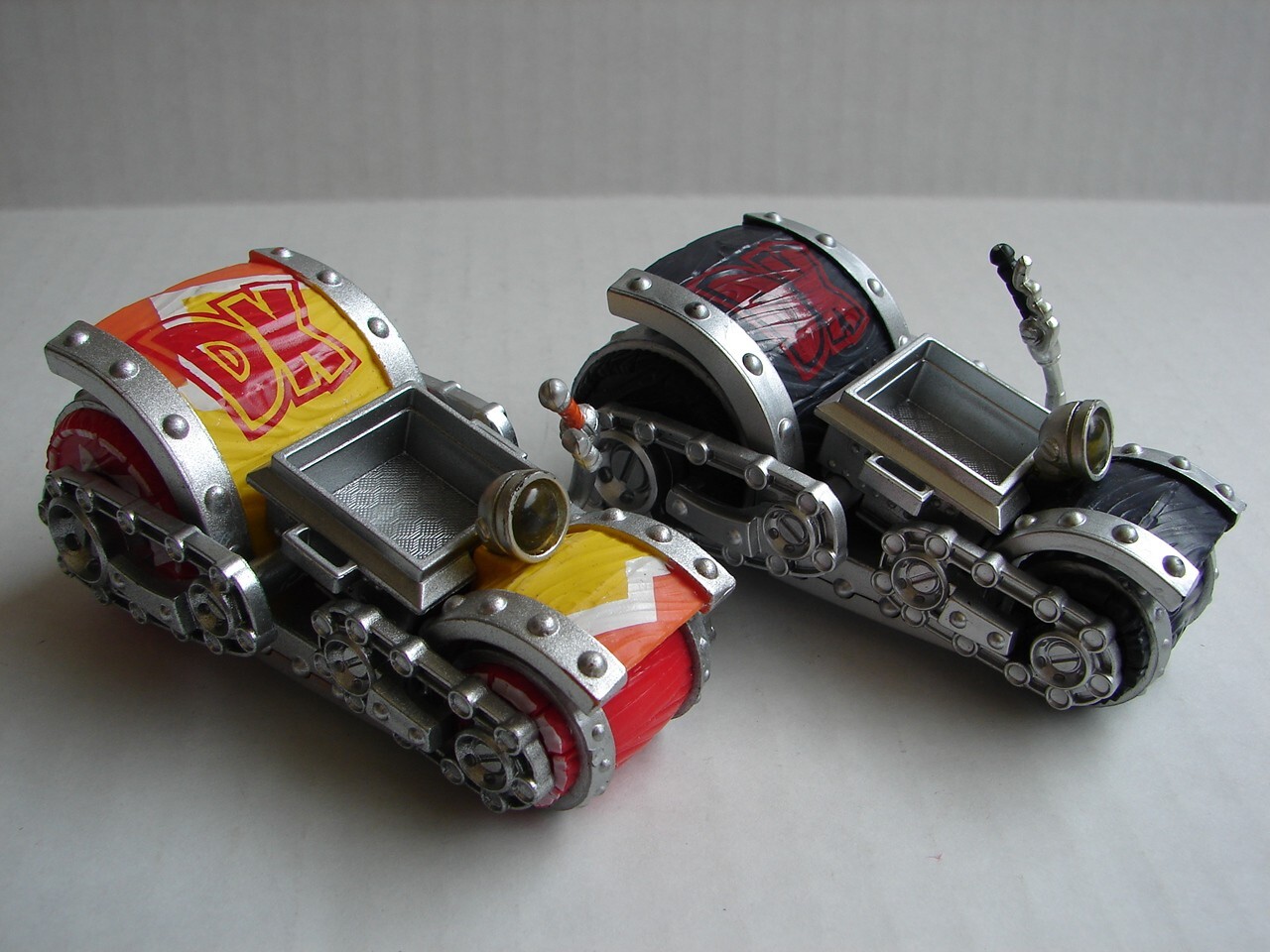 two different Skylanders: SuperChargers: Dark Barrel Blaster and yellow
